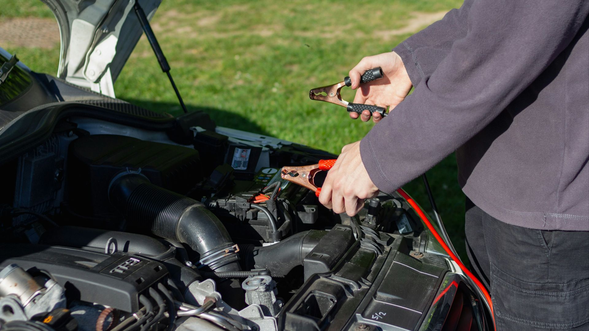 person in gray long sleeve shirt riding black motorcycle