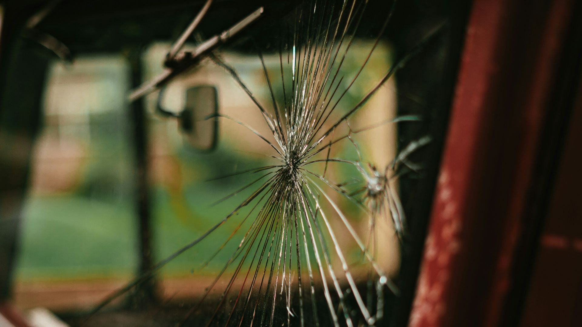 a bus is reflected in the side mirror