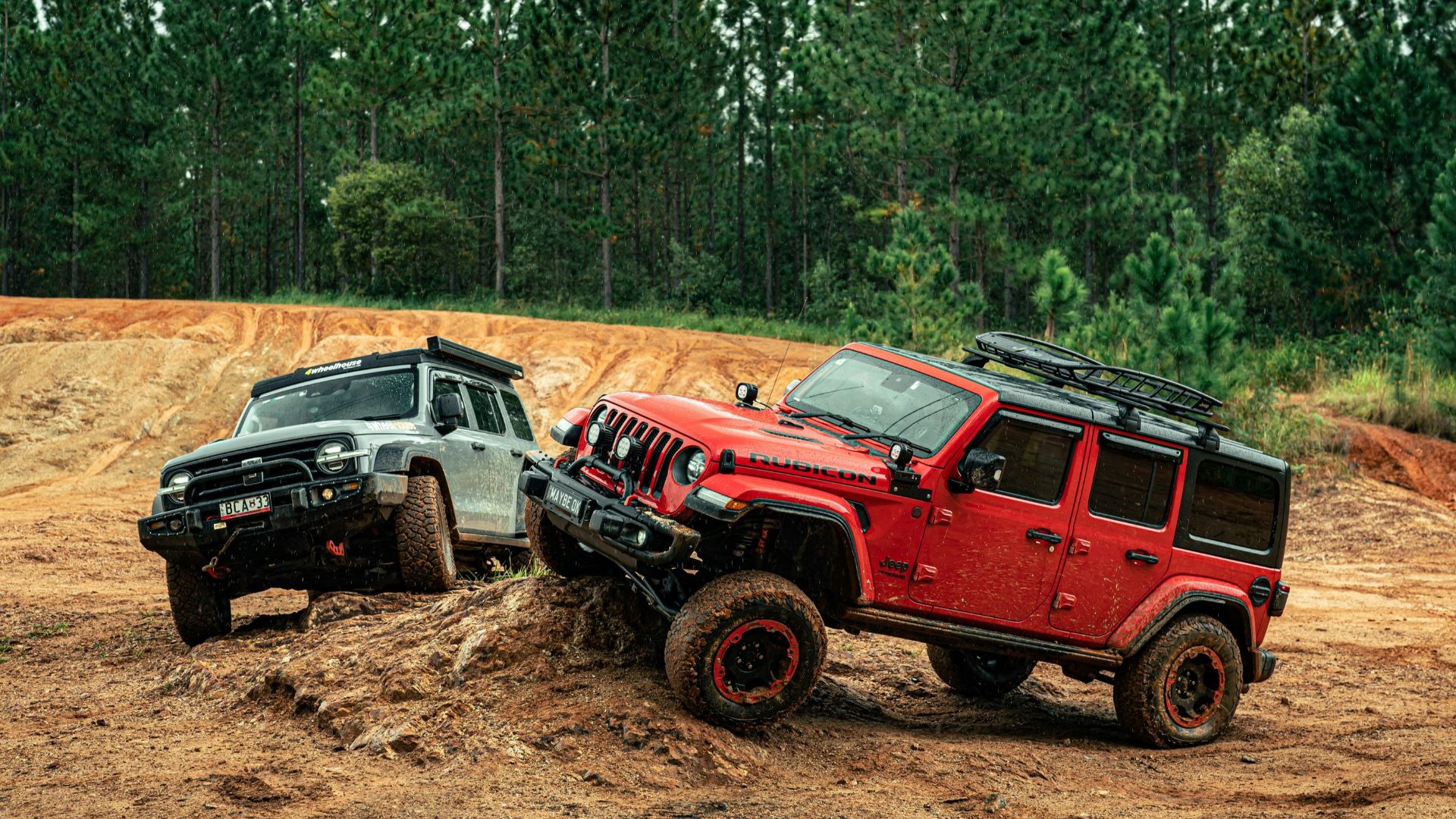 Two off-road vehicles navigating a dirt track