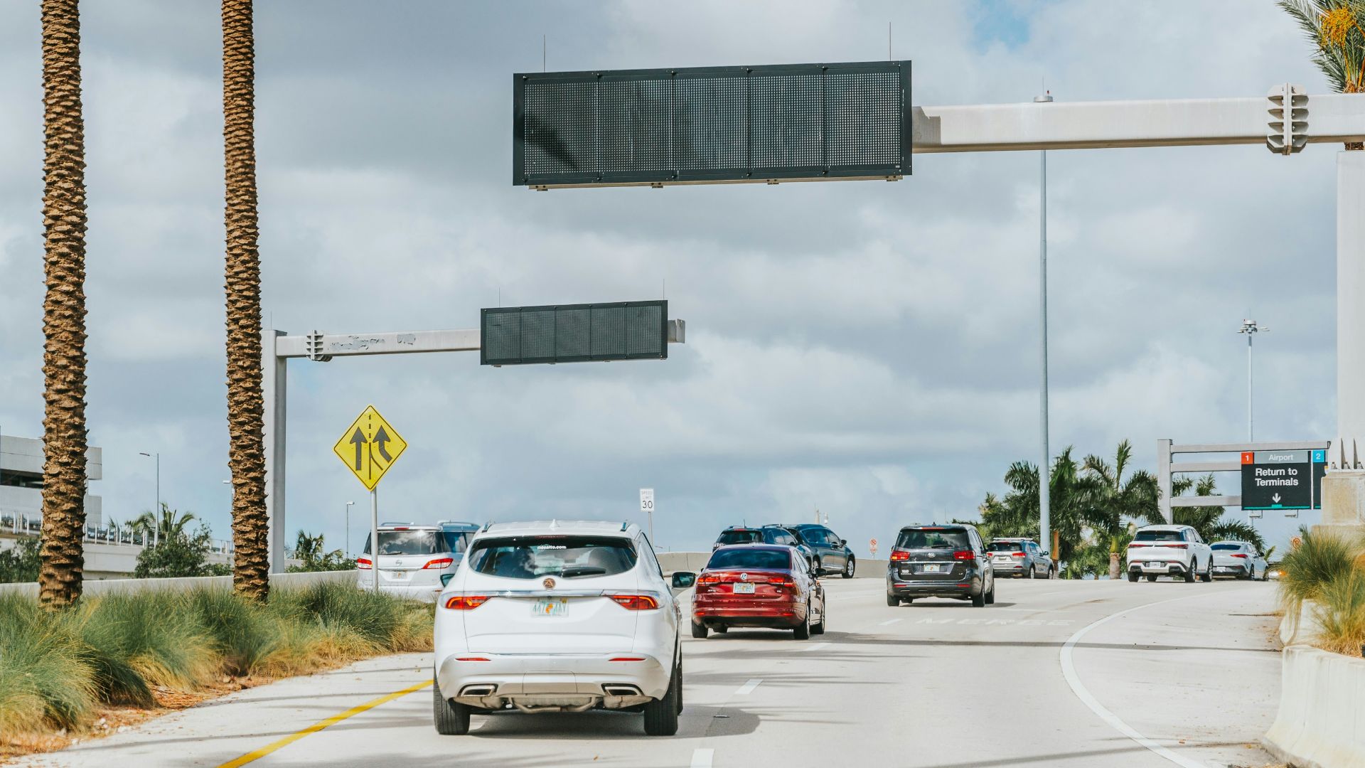 A bunch of cars that are sitting in the street
