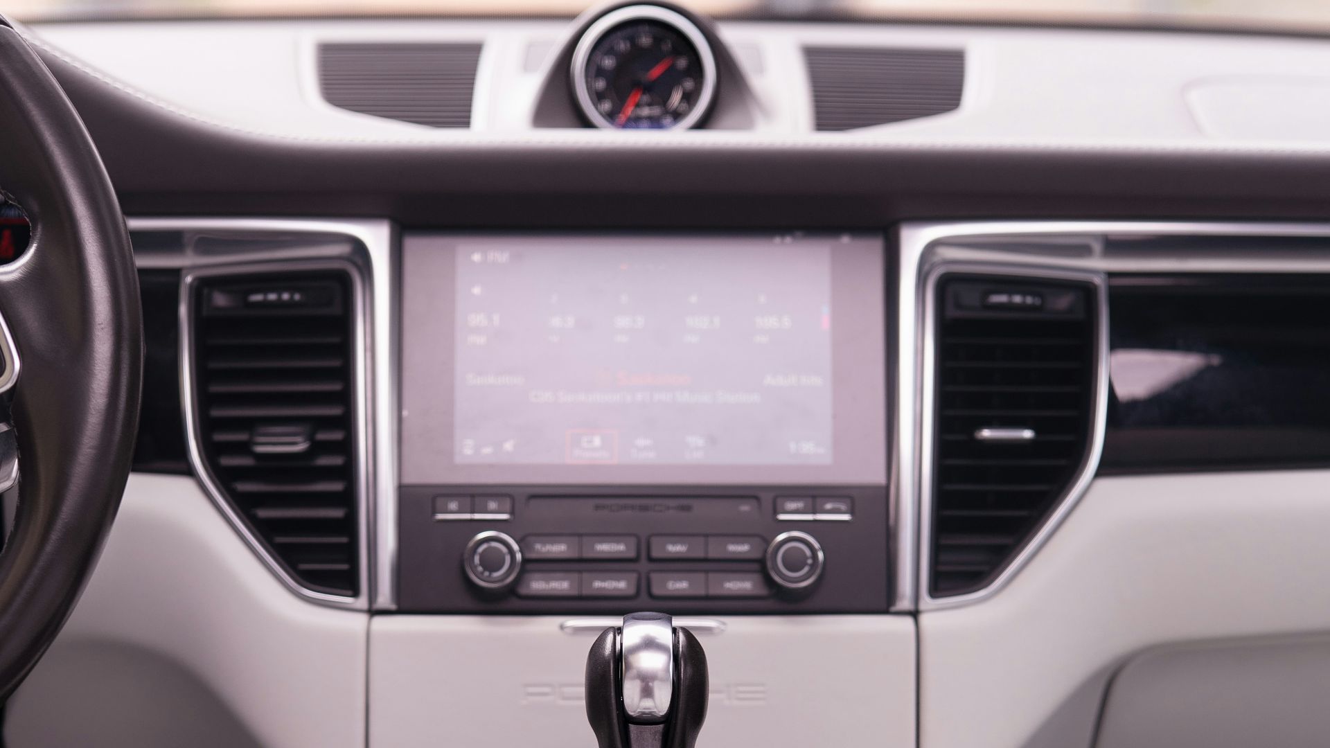Interior view of a luxury car's dashboard.