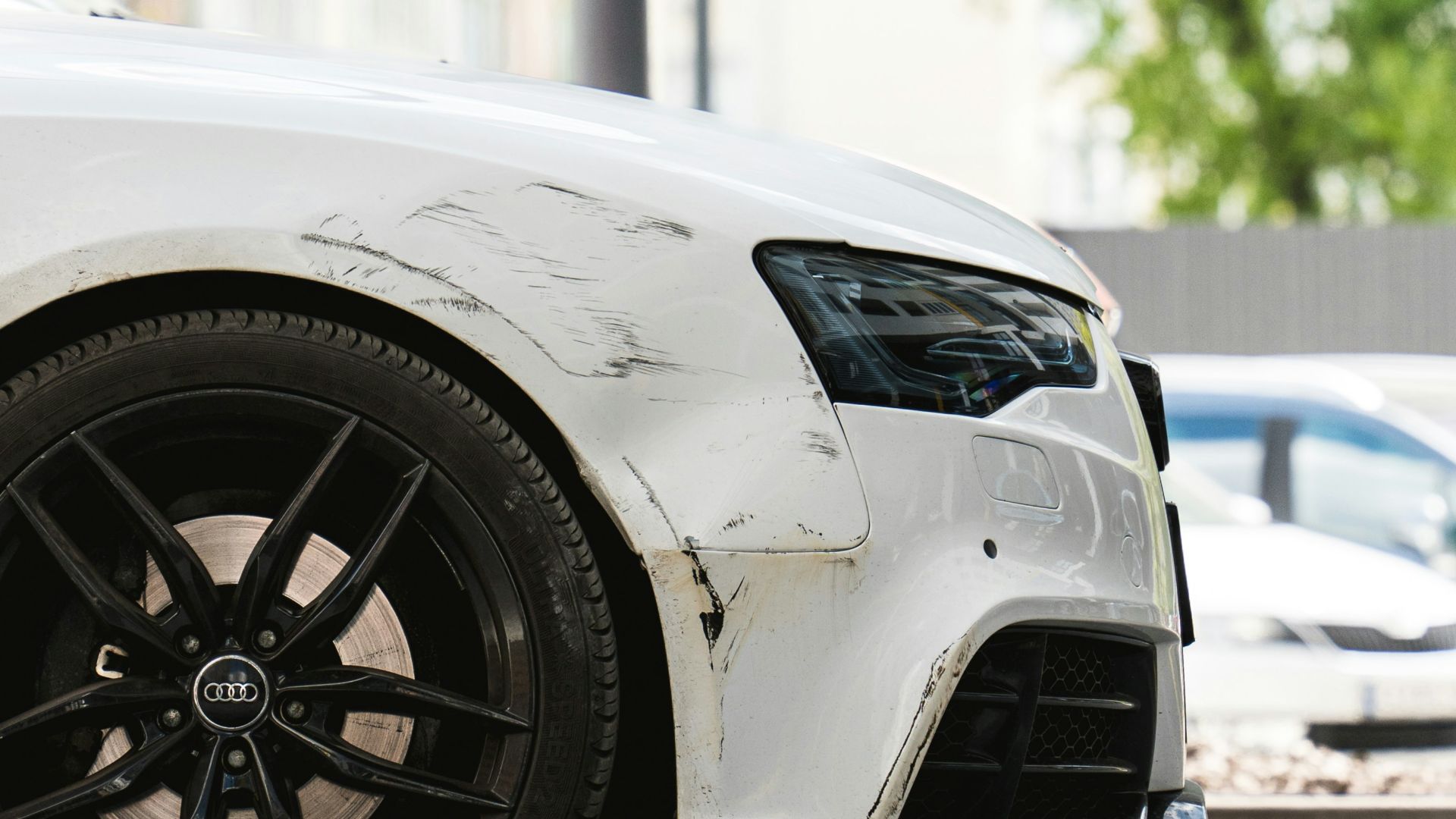 a white car parked on the side of the road