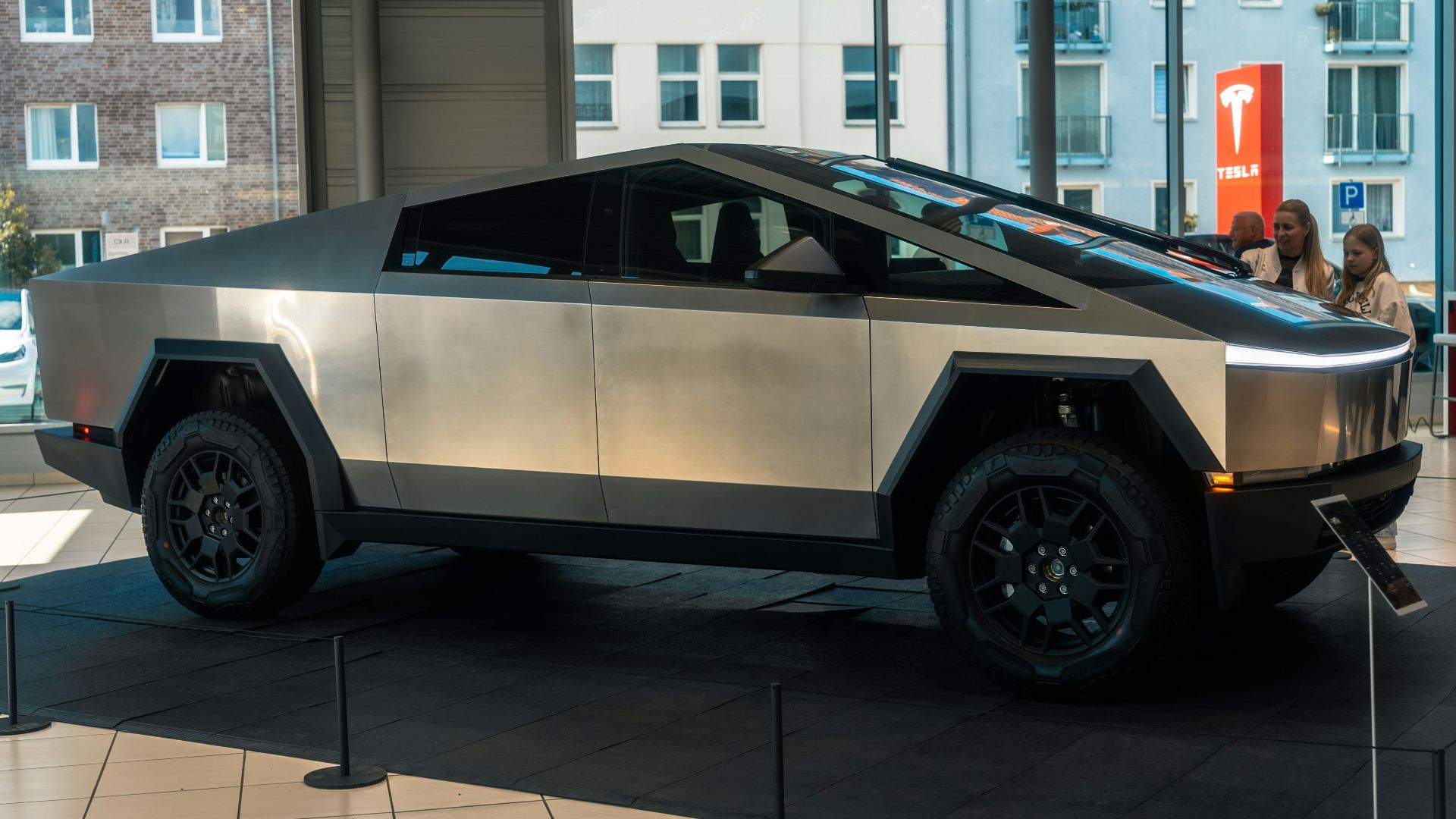 A futuristic car is on display in a building
