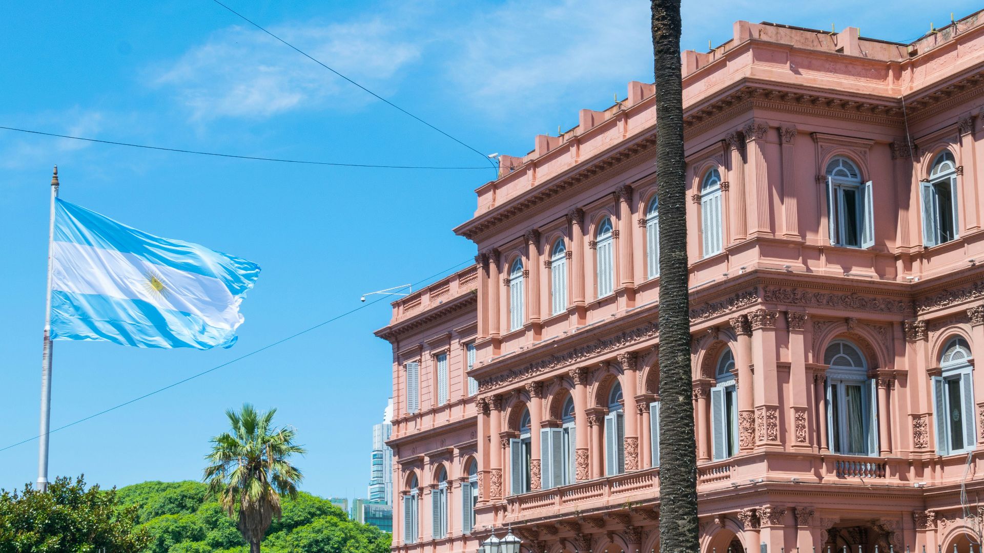 brown concrete building near green trees during daytime