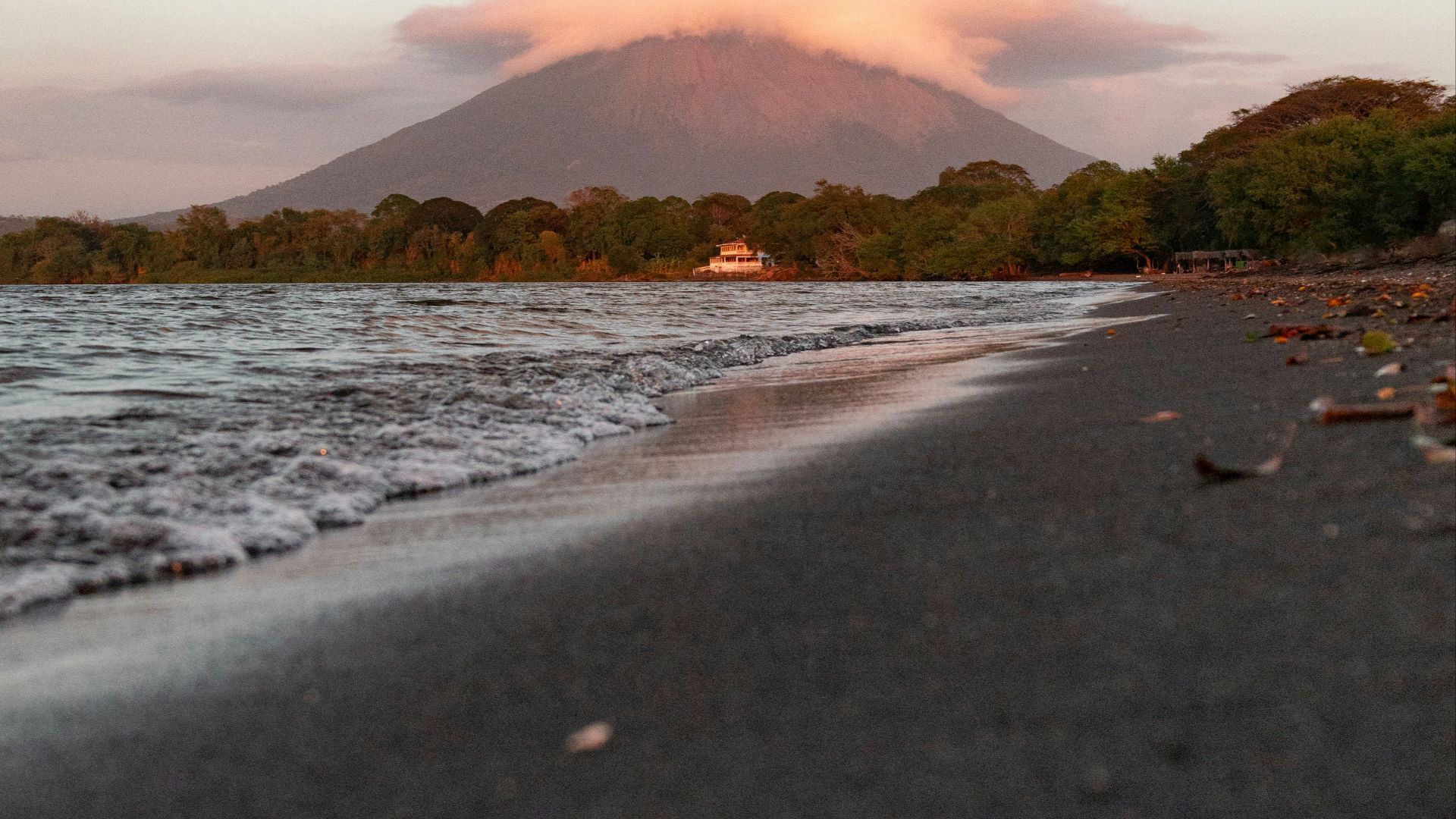 a beach with a mountain in the background