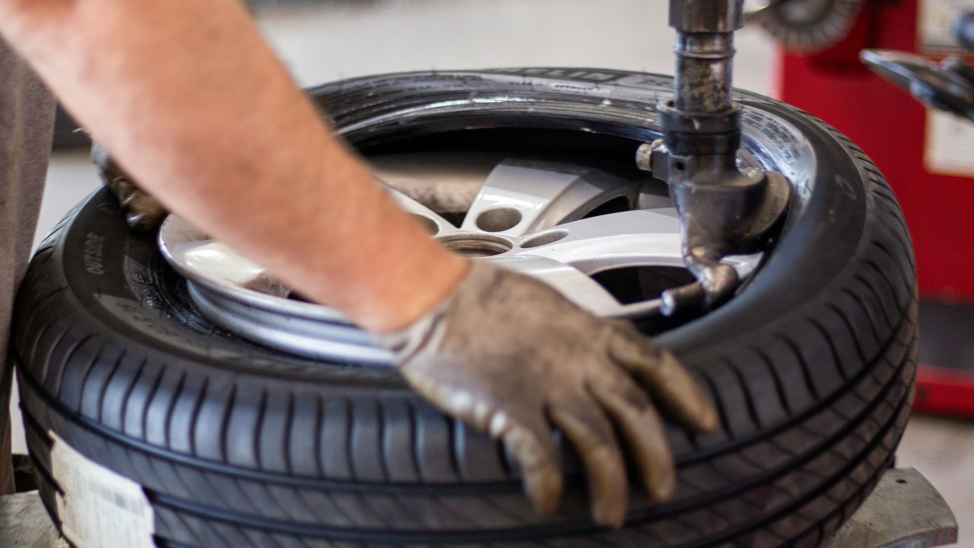 person holding black and gray metal tool