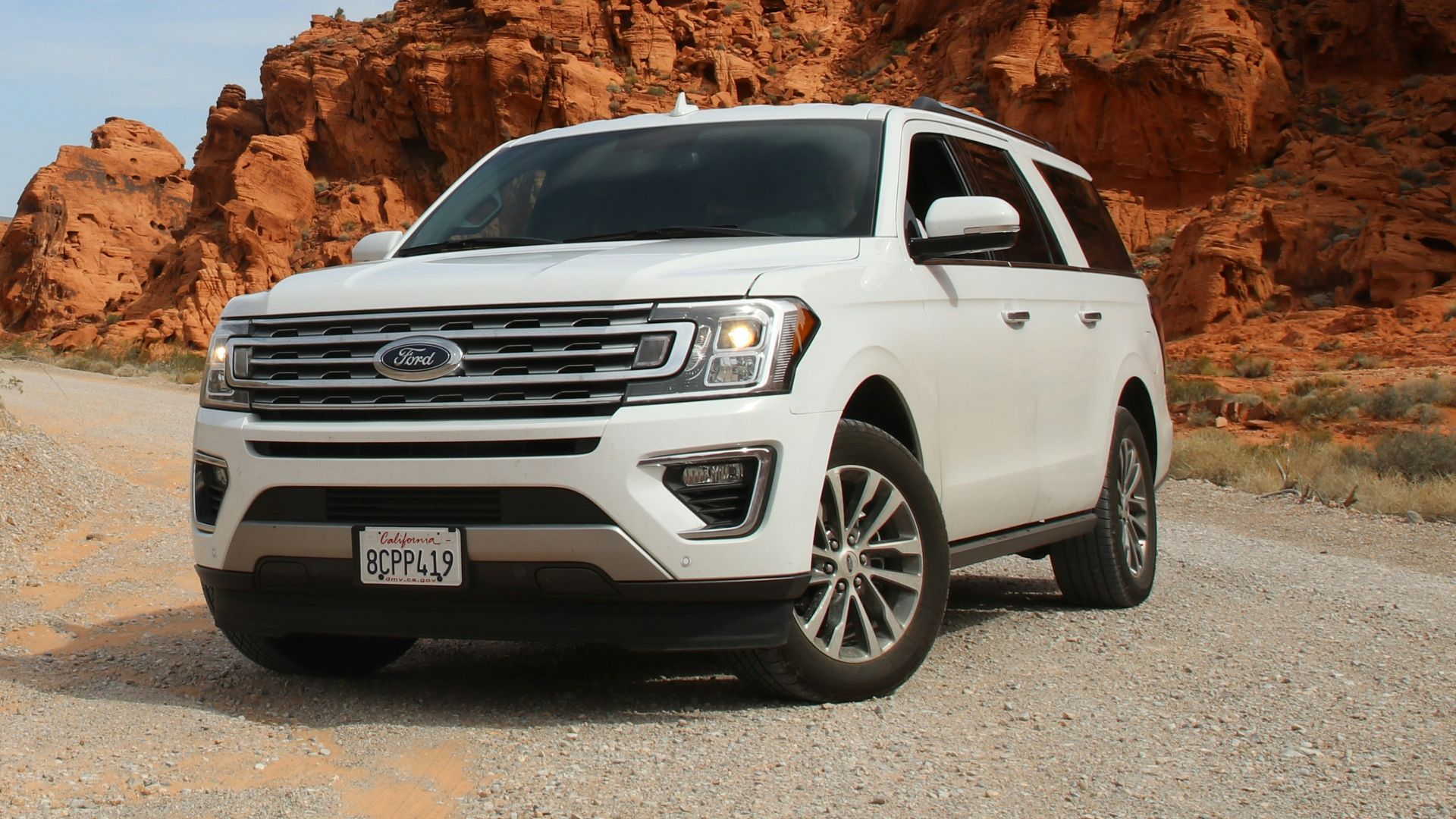 parked white Ford Explorer SUV
