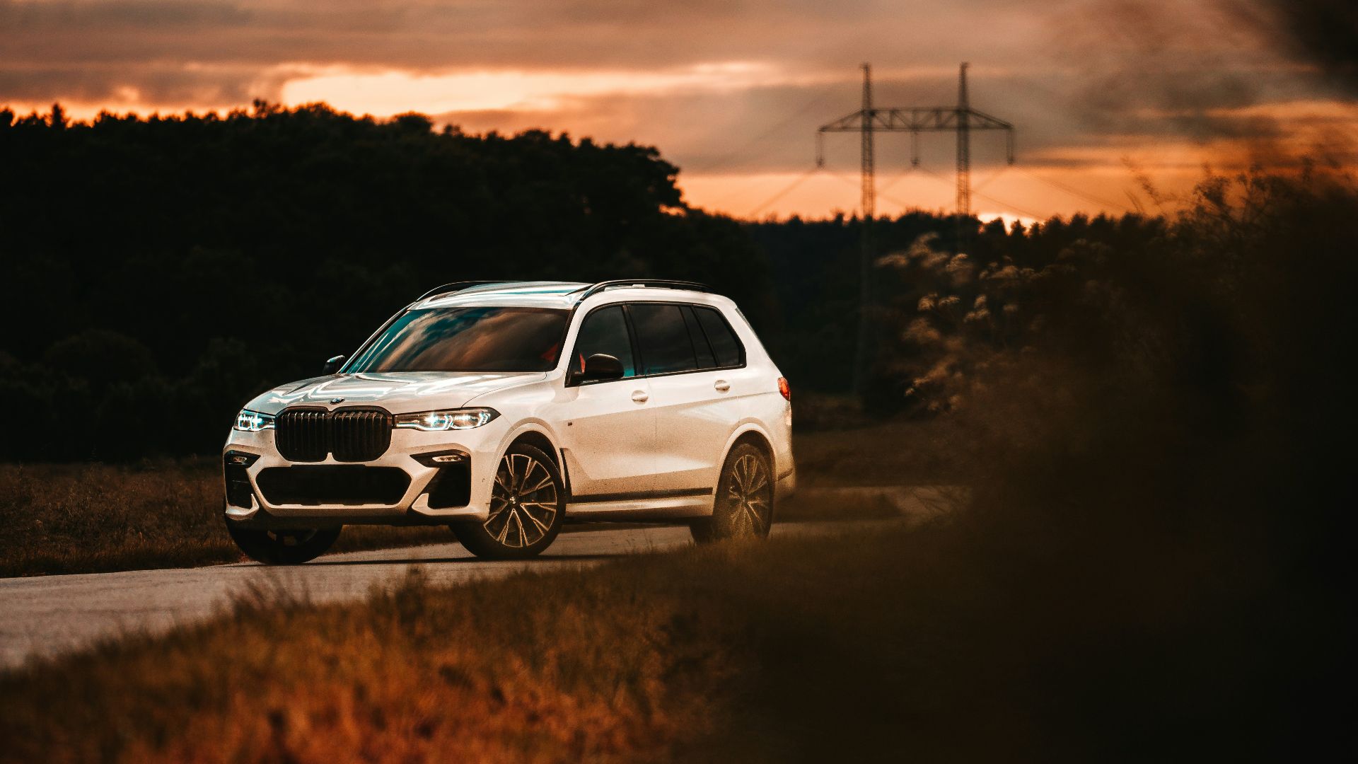 white suv on brown field during sunset