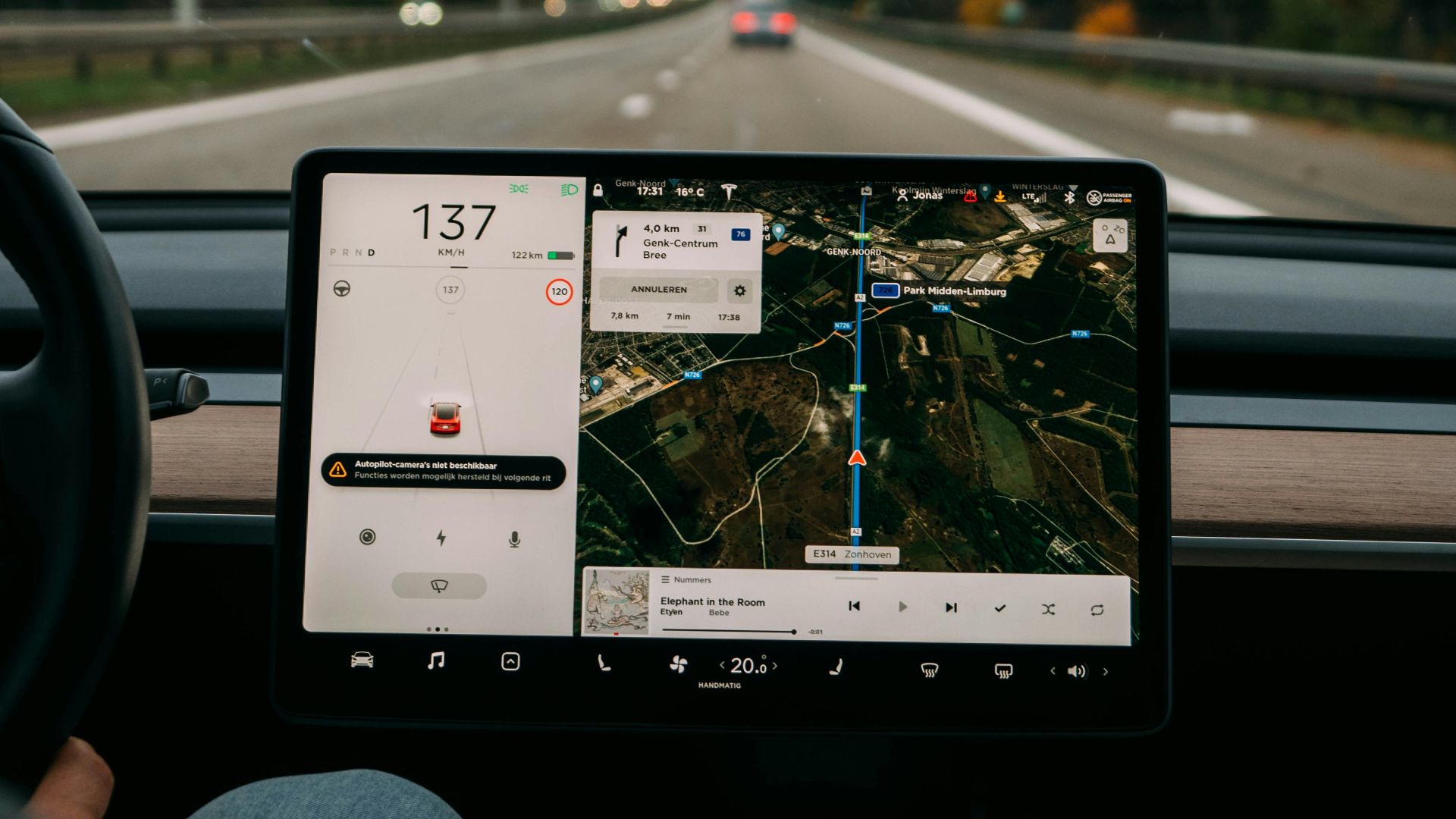 person holding white ipad inside car