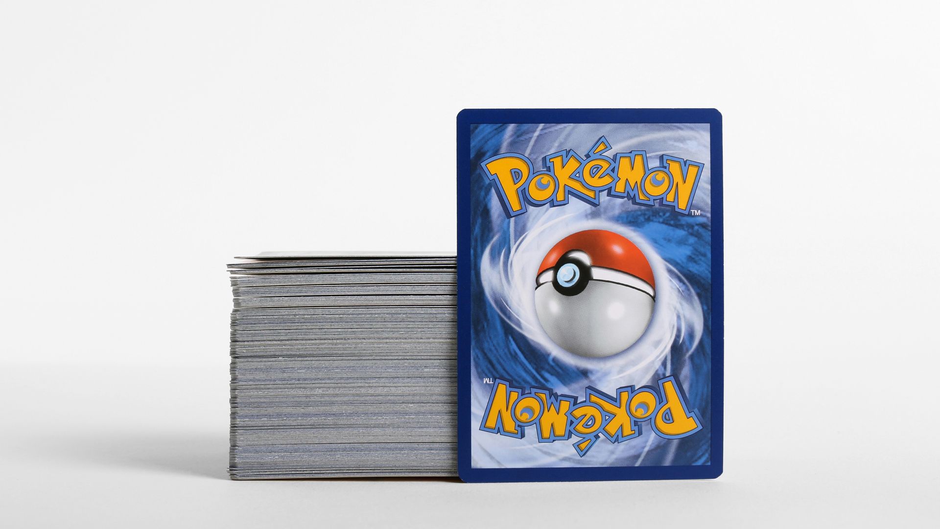 a stack of cards with a pokemon logo on them