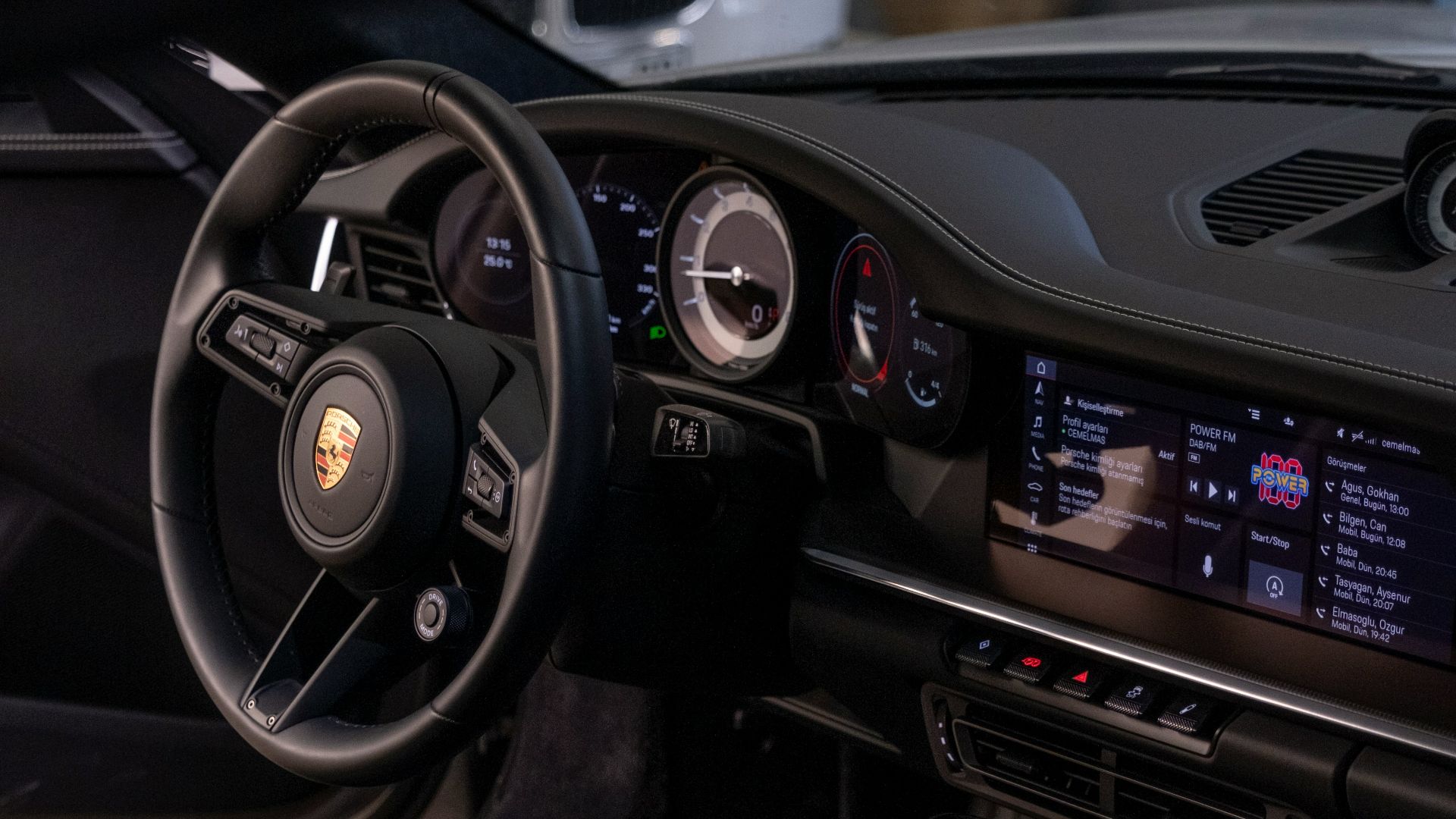 the interior of a car with a steering wheel and dashboard