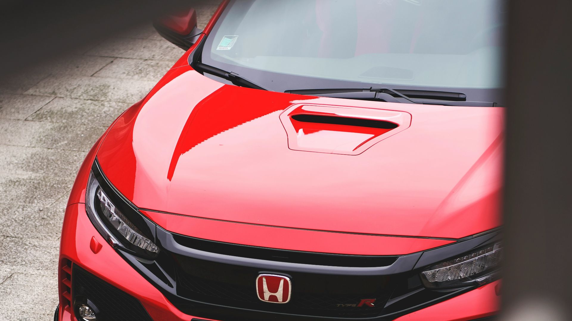 red Honda vehicle
