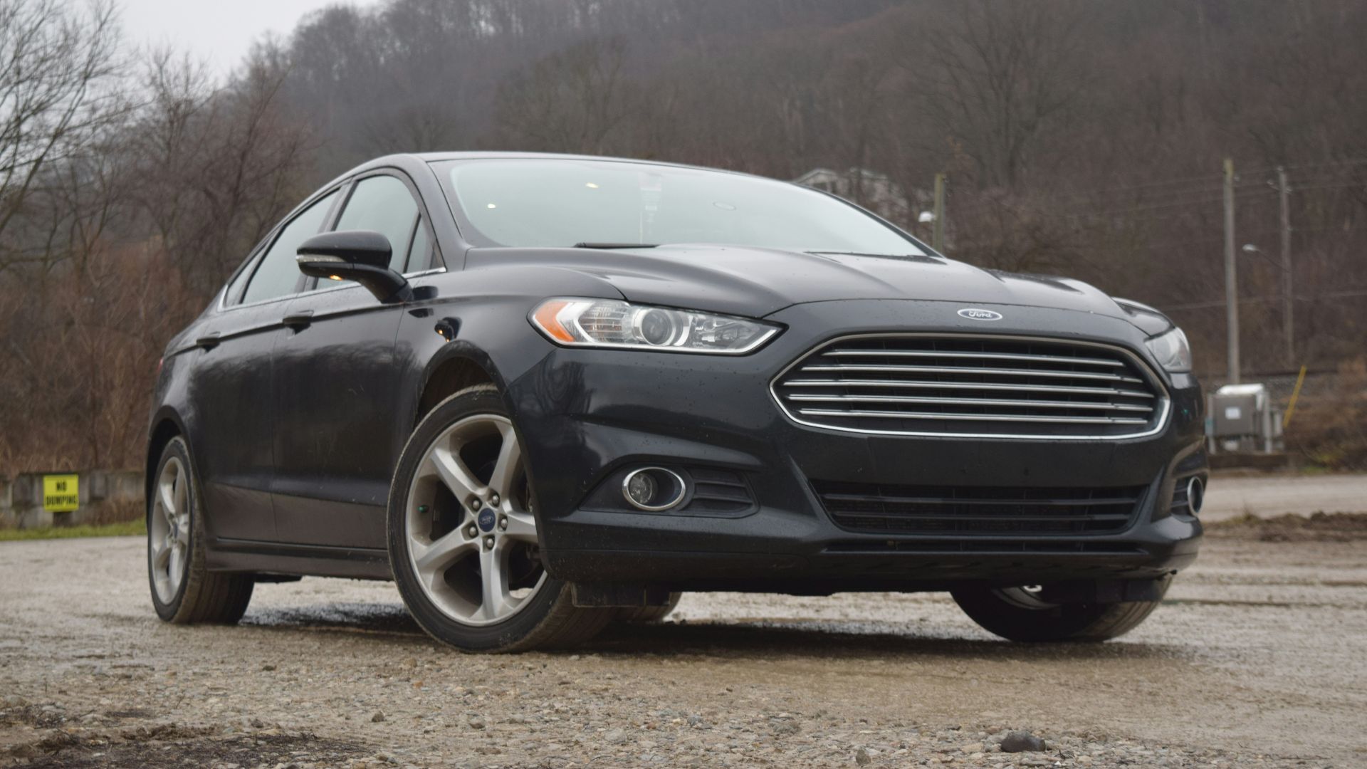 a black car parked in a parking lot