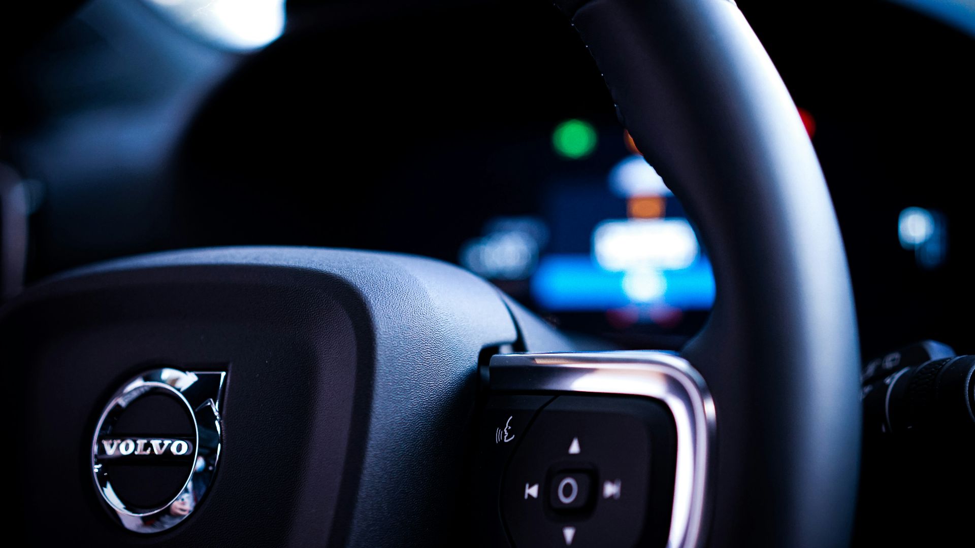 a close up of a steering wheel of a car