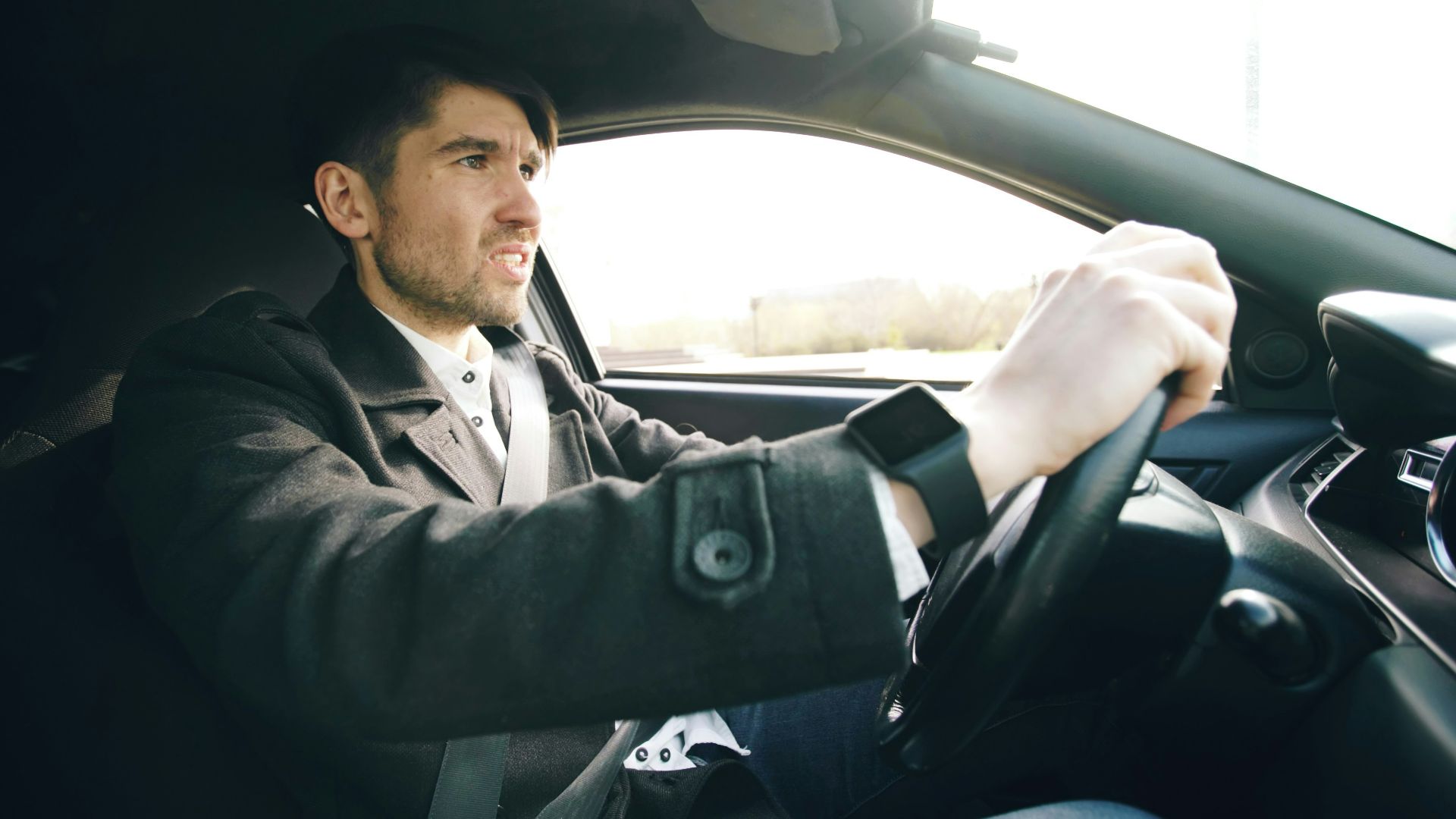 Man driving a car with intensity