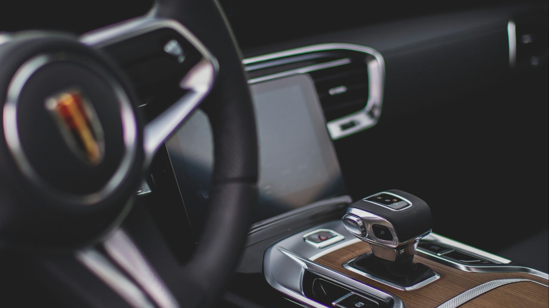 a steering wheel and dashboard of a car