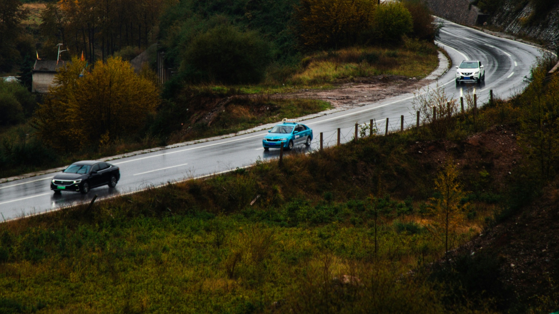 Cars driving on a road in the mountains
