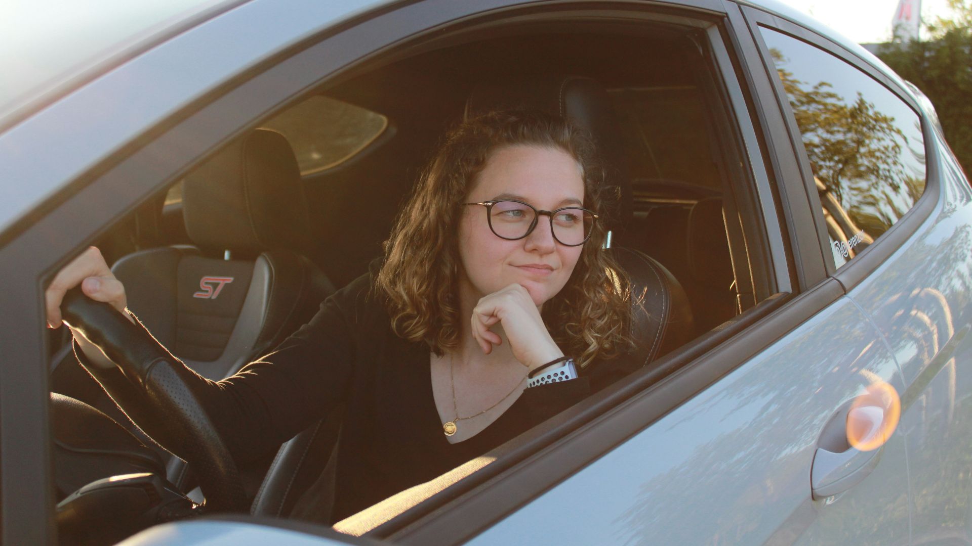 a woman sitting in a car