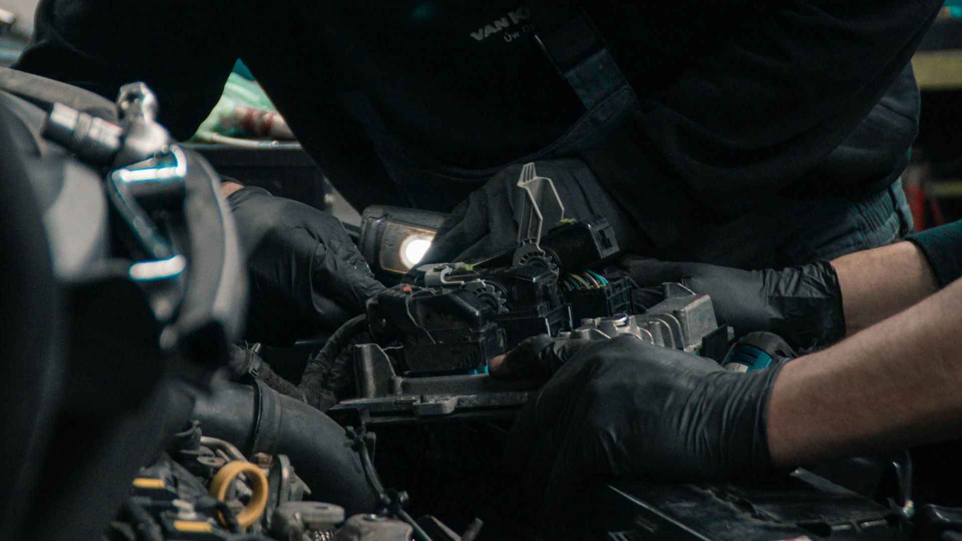 man in black jacket and blue denim jeans riding motorcycle