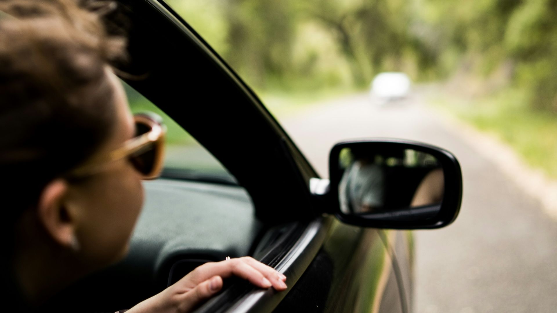 woman sitting inside vehicle