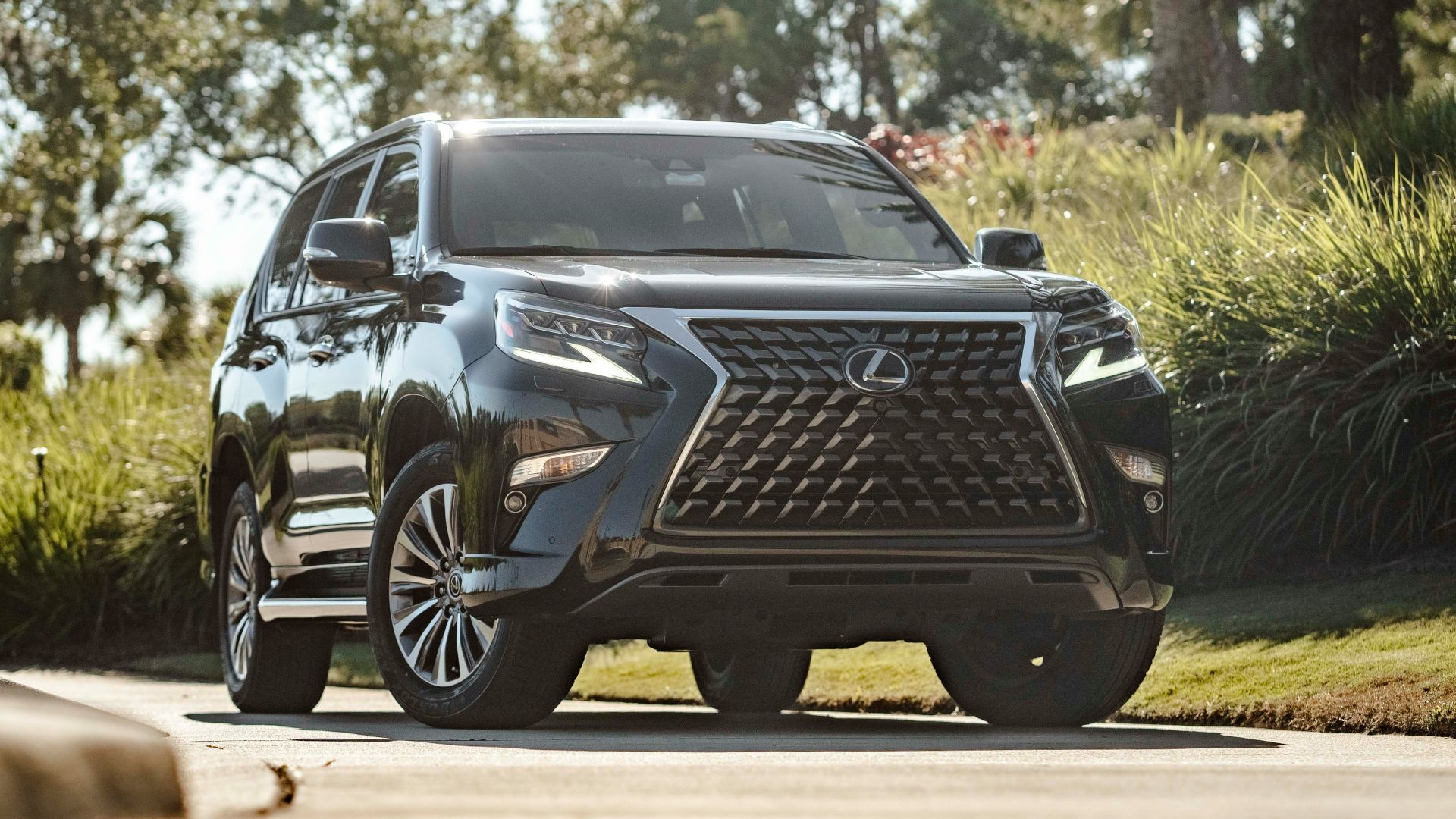 a black suv parked on the side of the road