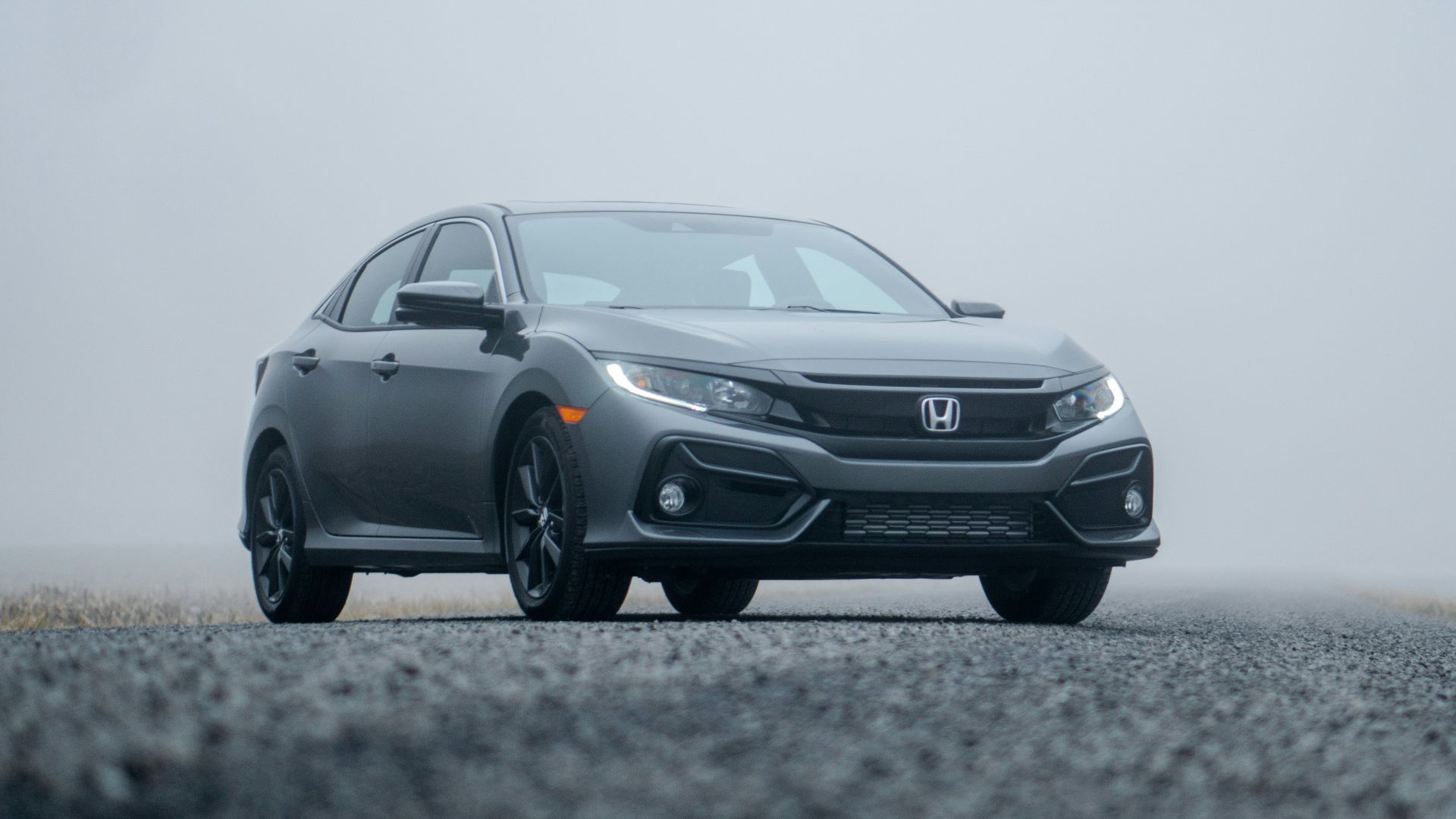 gray Honda sedan parked on road during day