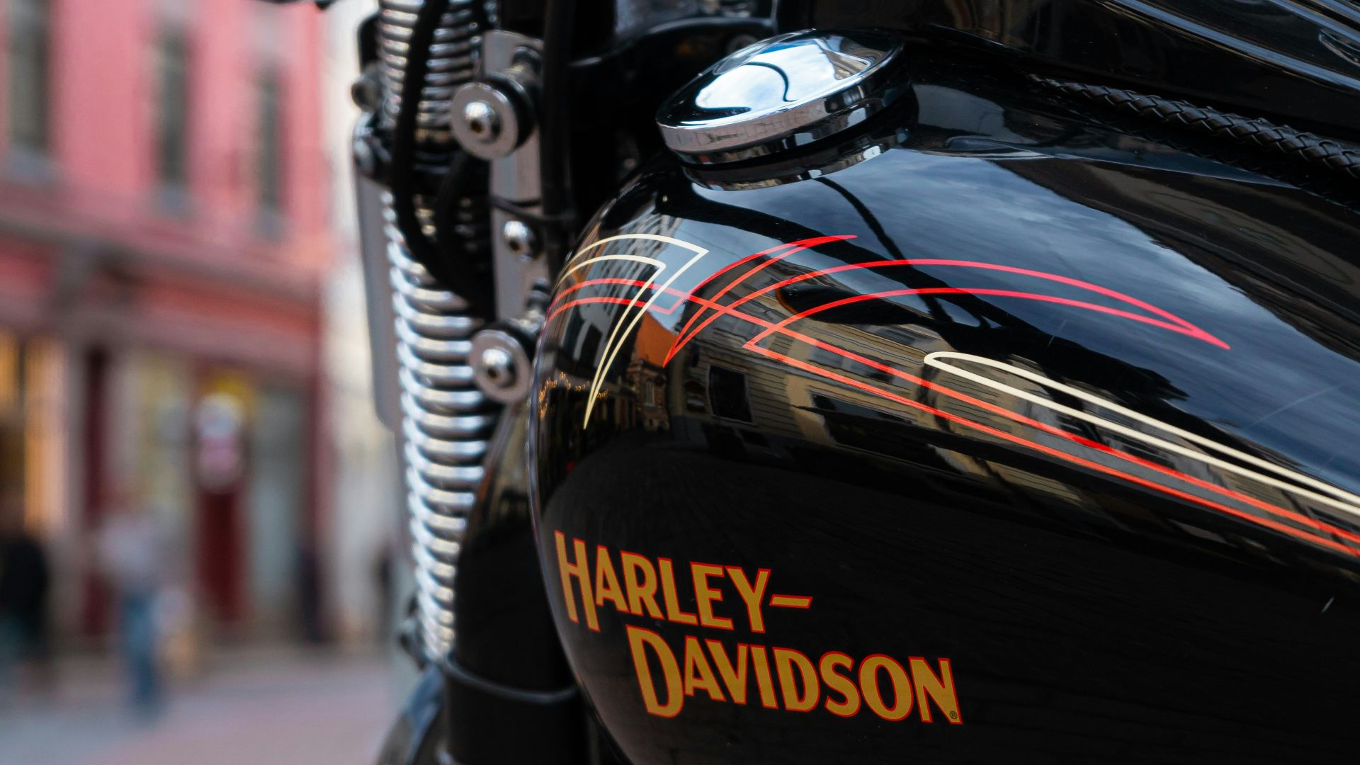 a harley davidson motorcycle parked on a city street