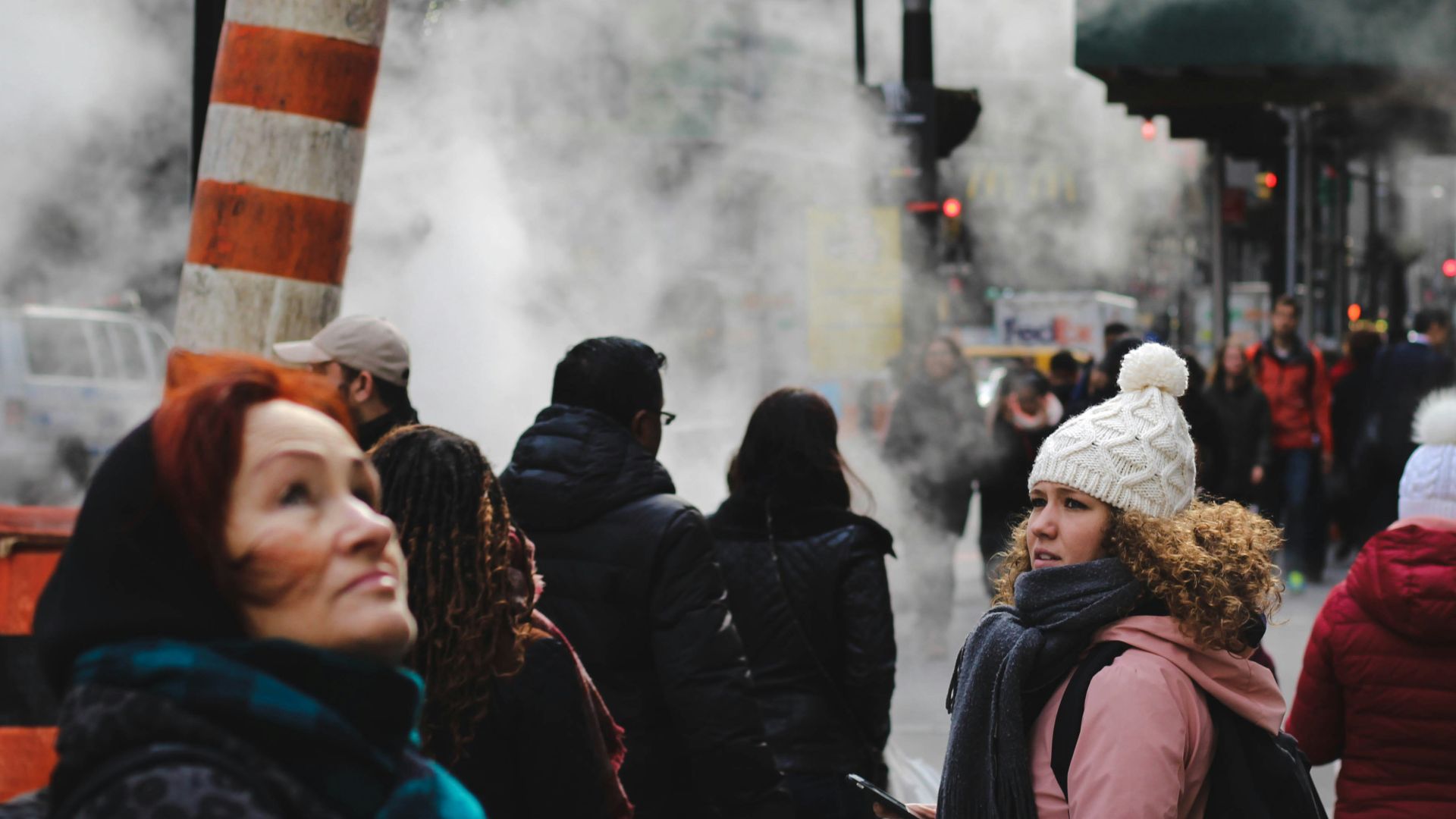 people standing near teal concrete building