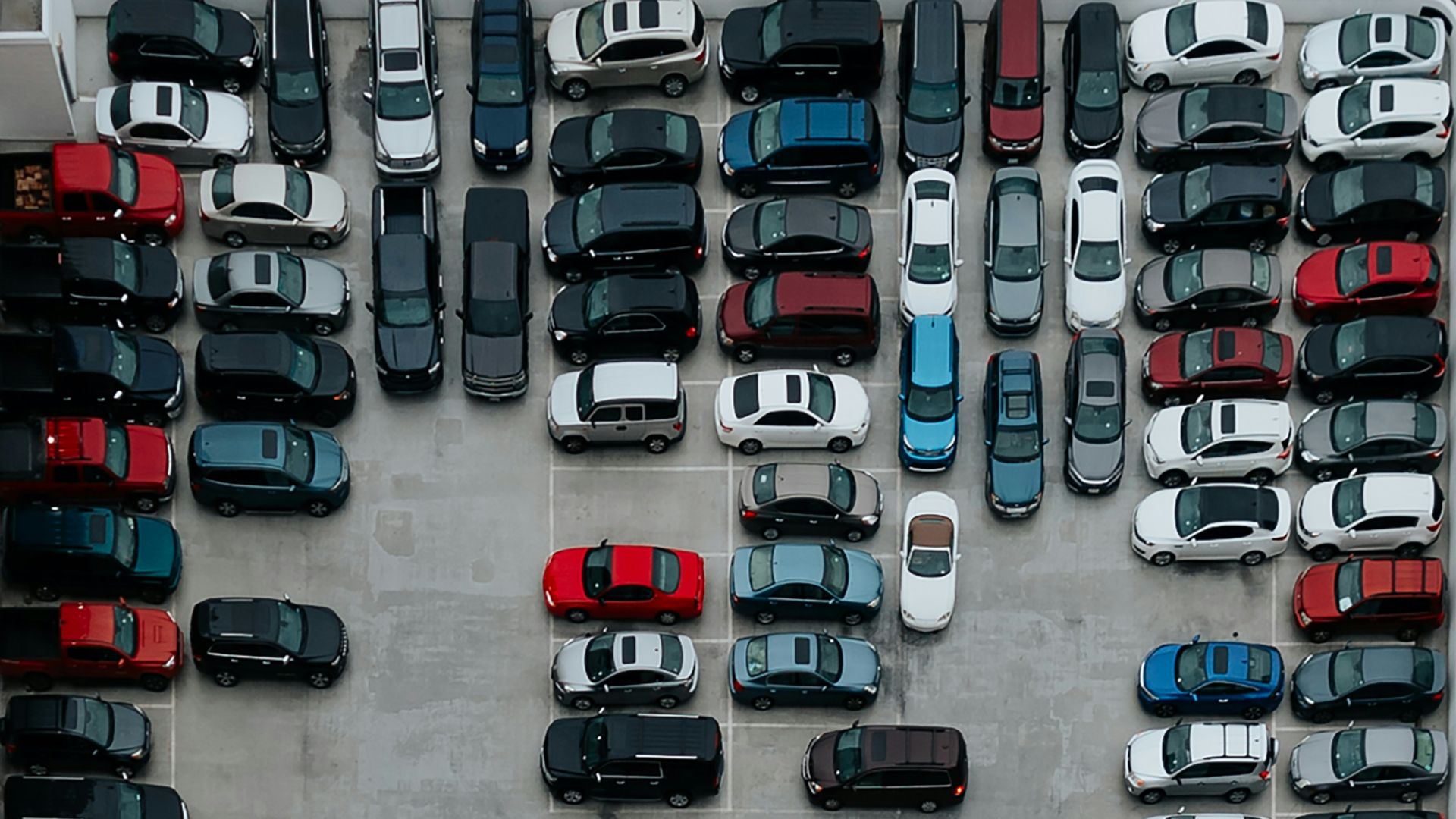 aerial photography of cars on parking lot