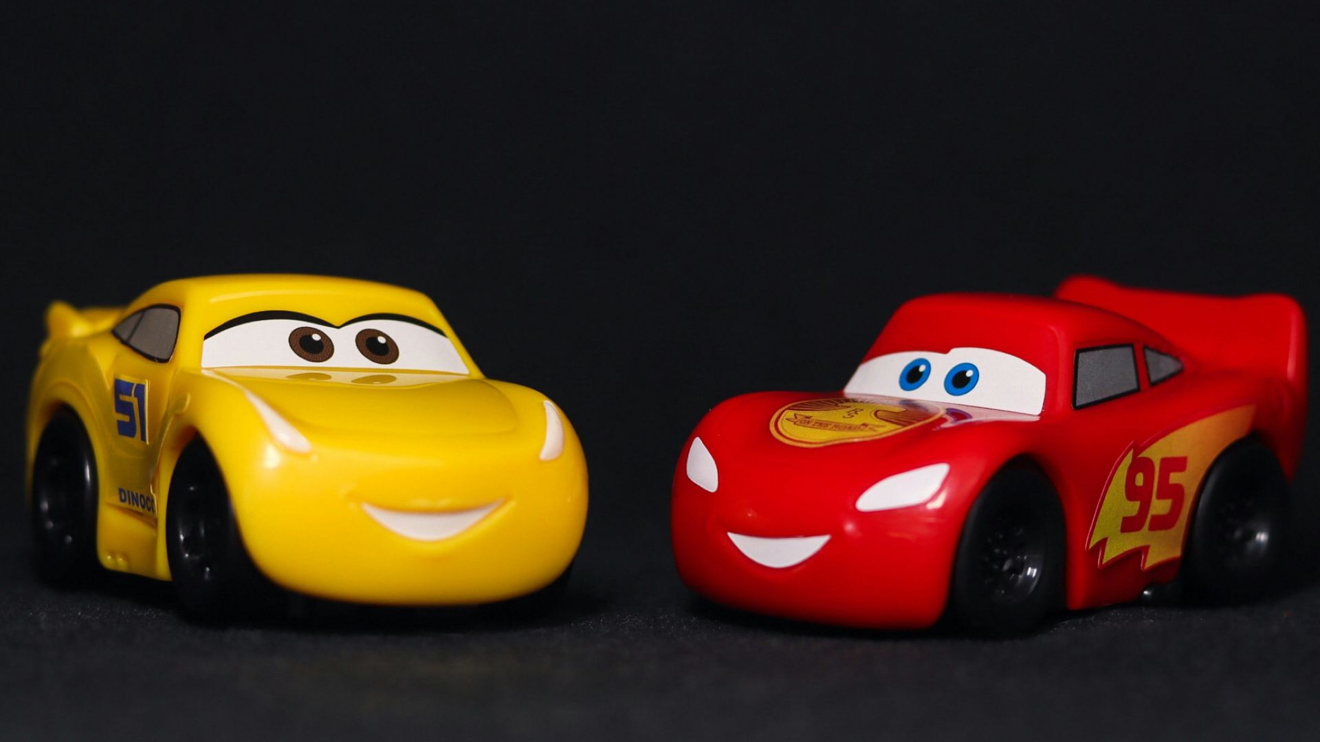a couple of toy cars sitting next to each other