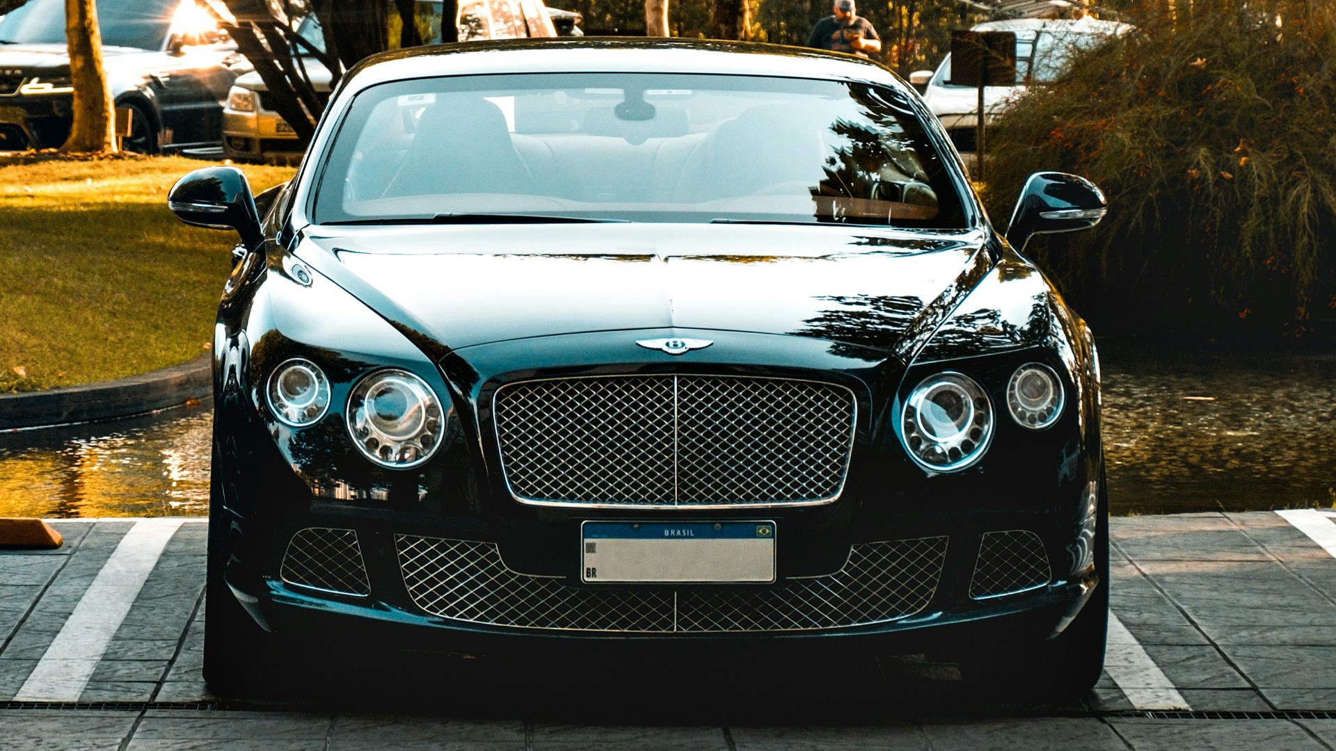 a black car parked in a parking lot