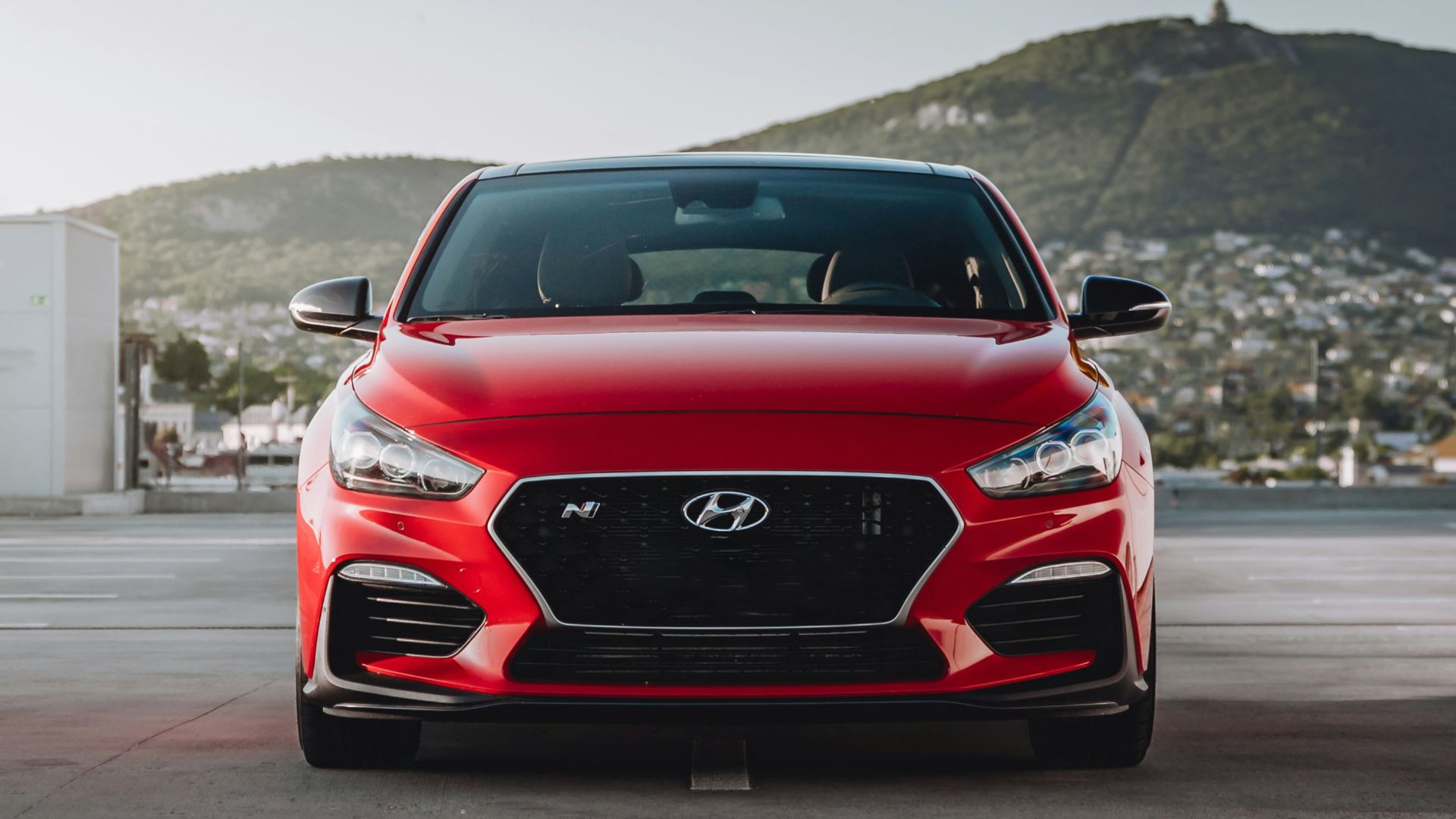 red bmw m 3 on road during daytime