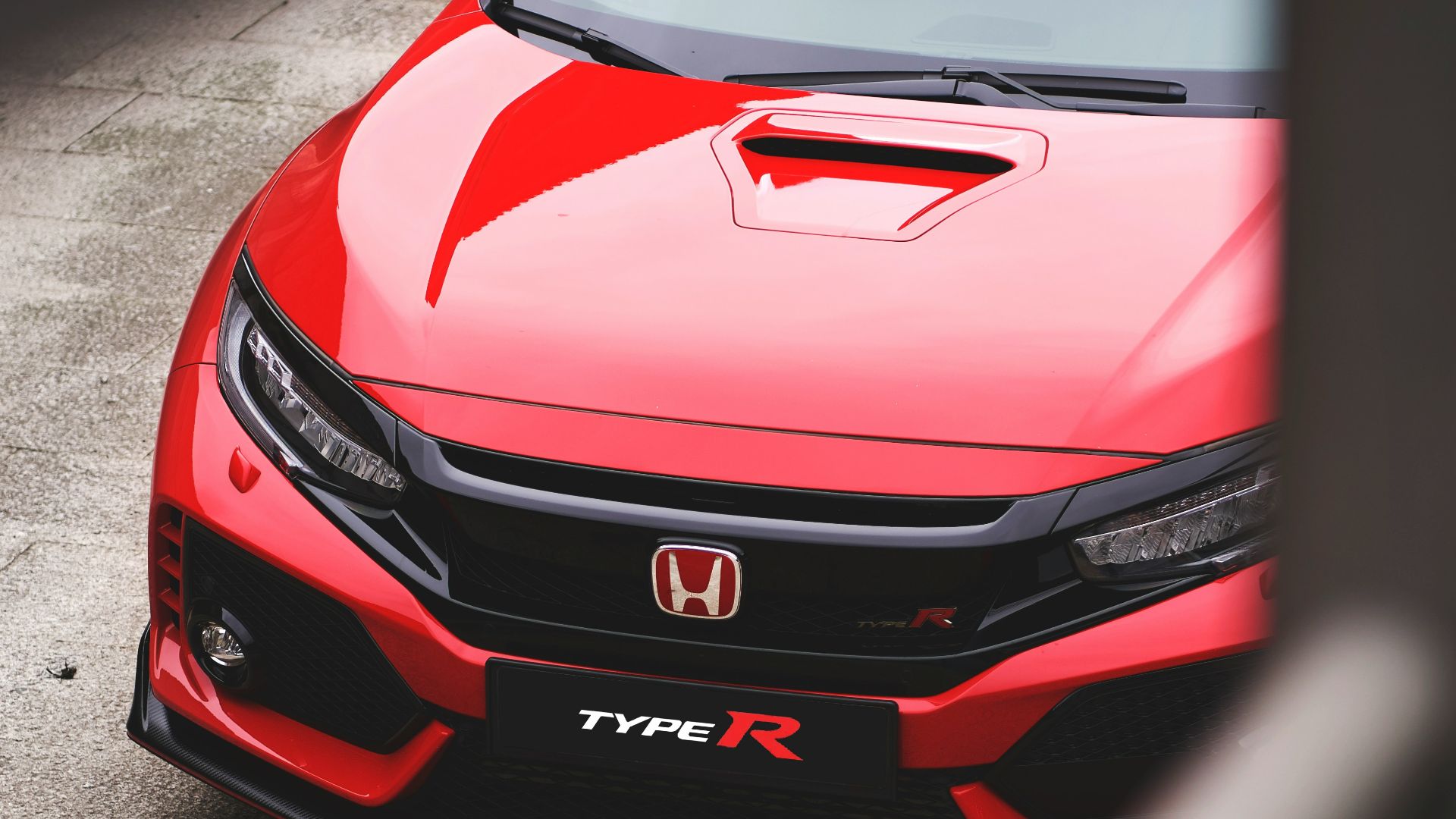 red Honda vehicle