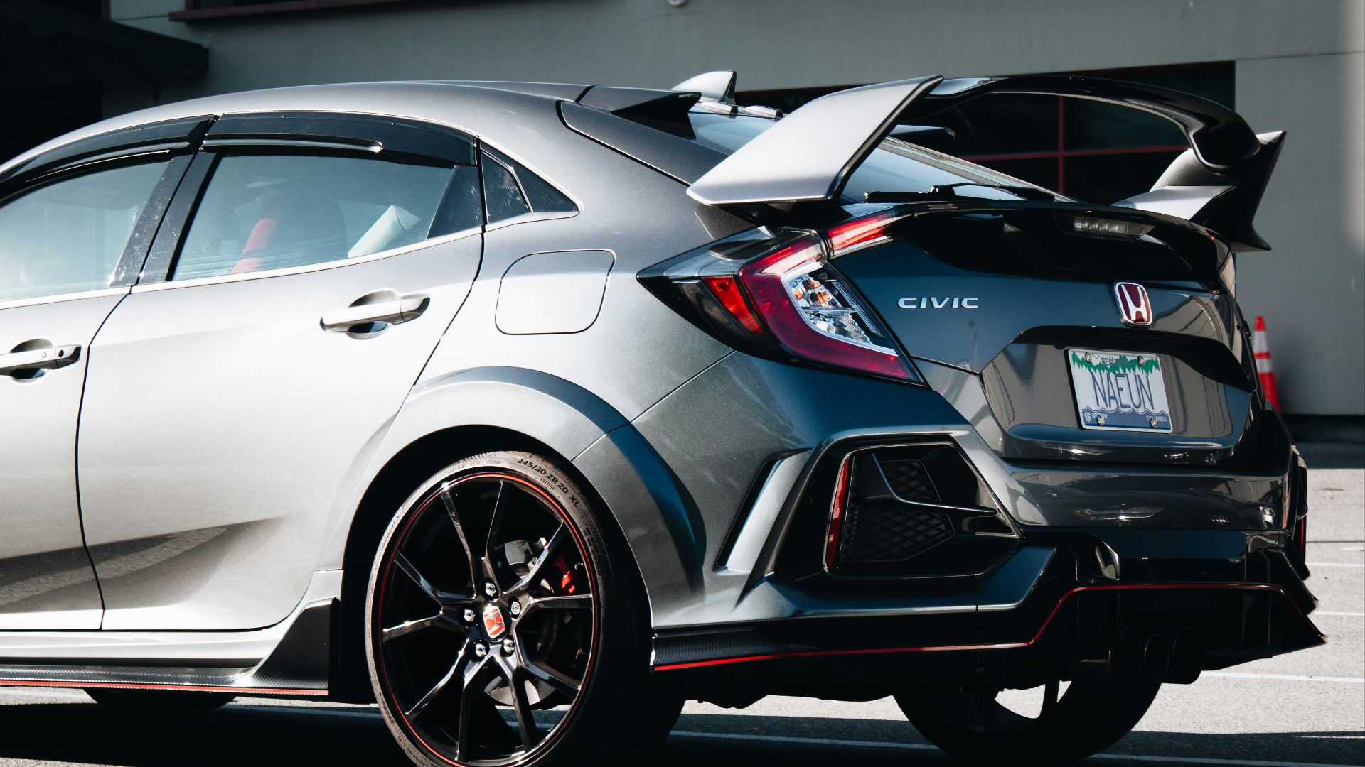 a silver car parked on the side of the road