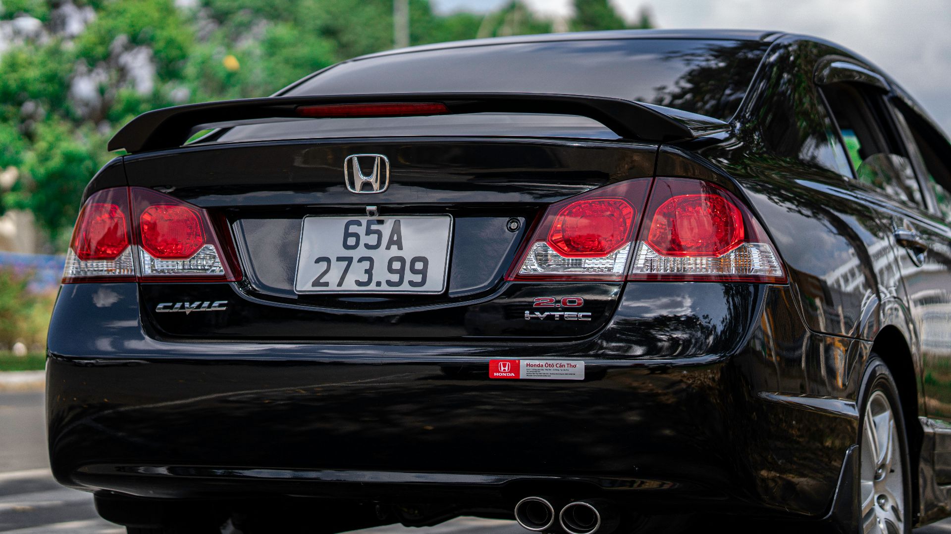 a black car parked on the side of the road