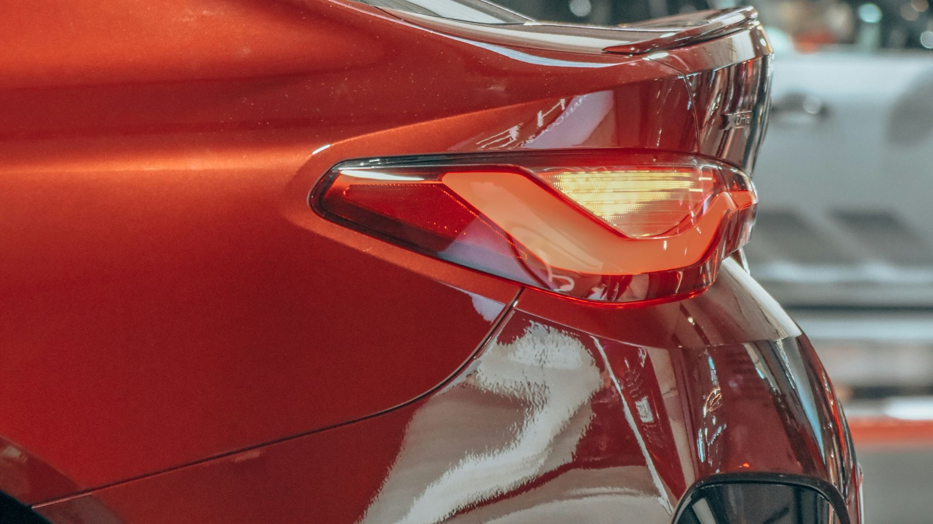 a red car with a white ribbon