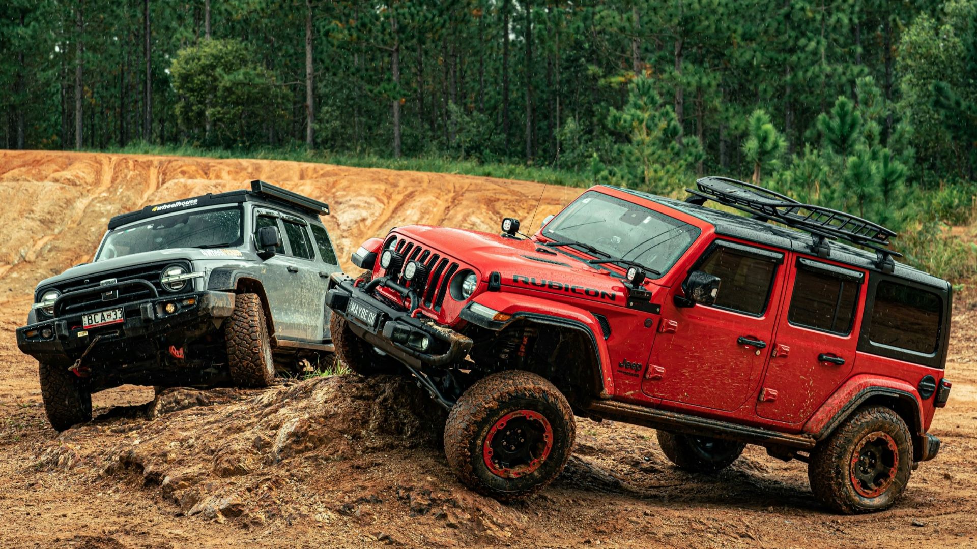 Two off-road vehicles navigating a dirt track
