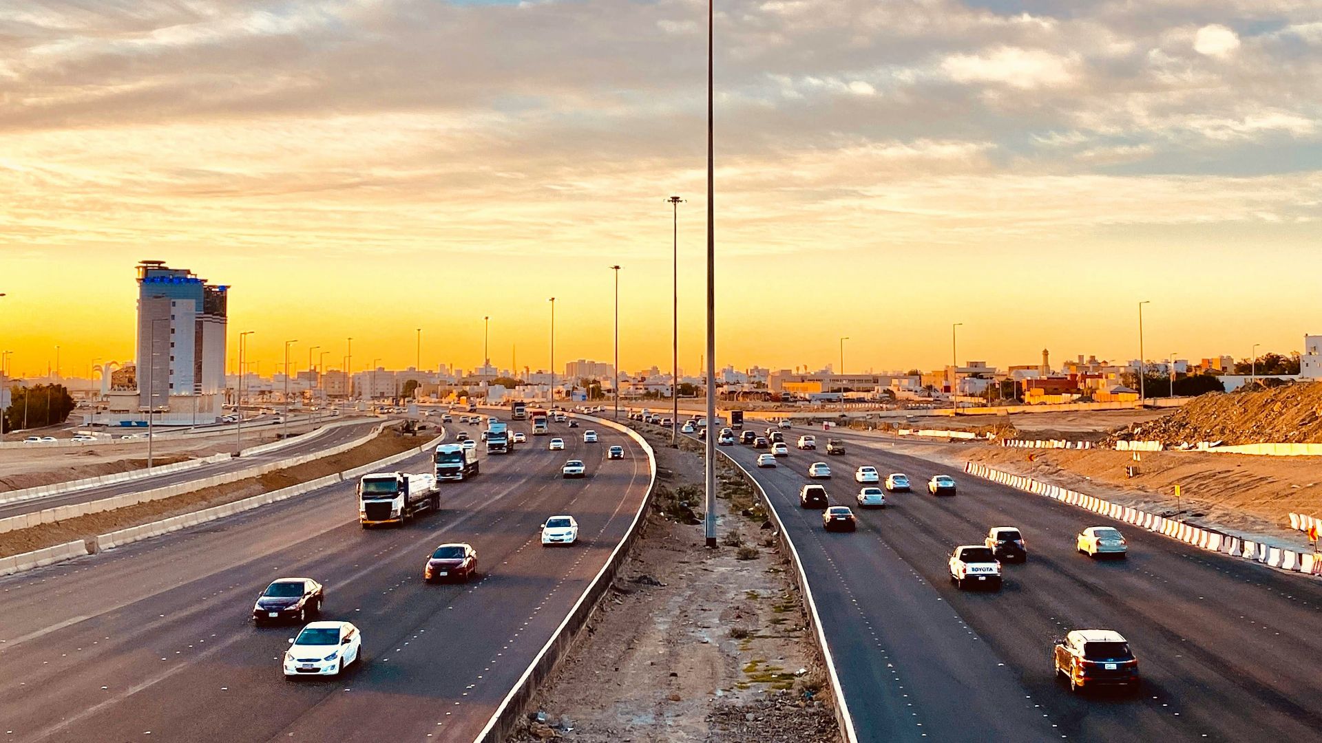 cars on road during sunset