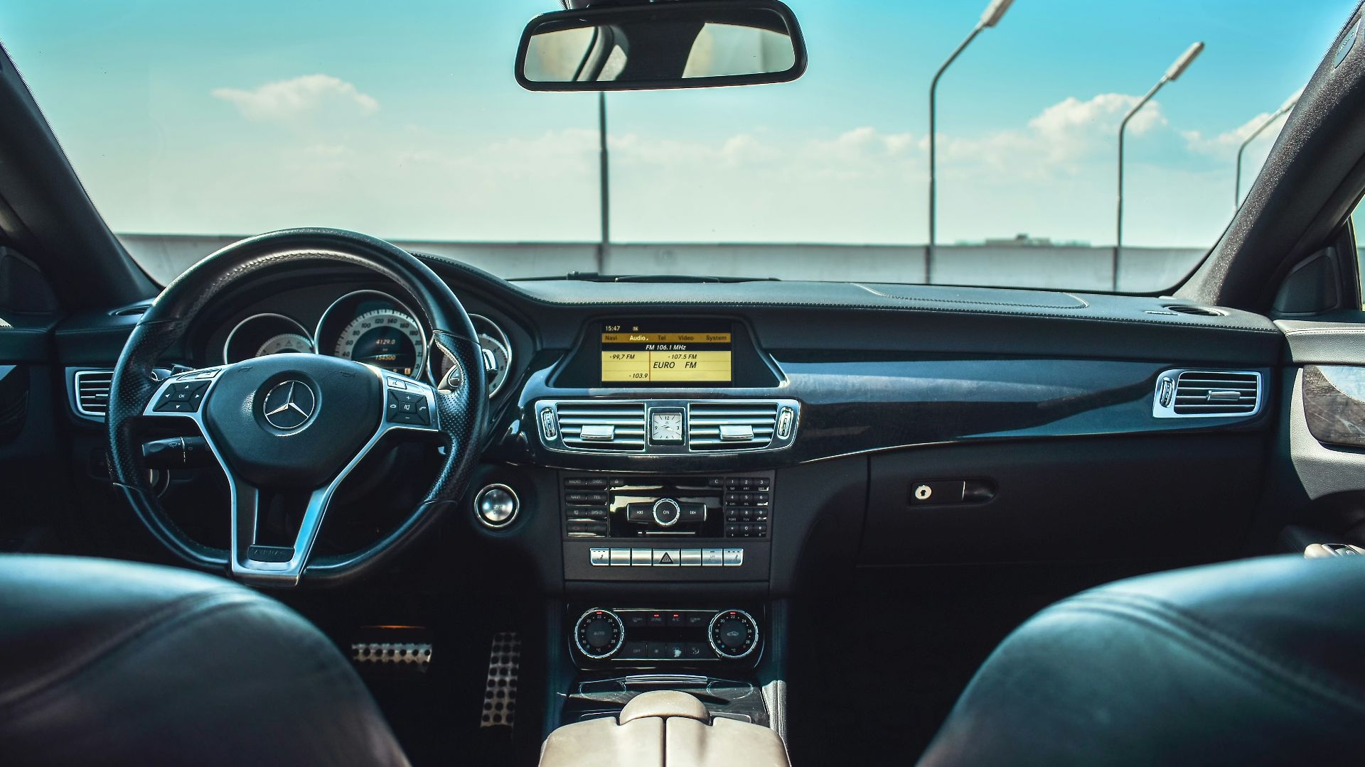 black Mercedes-Benz vehicle steering wheel