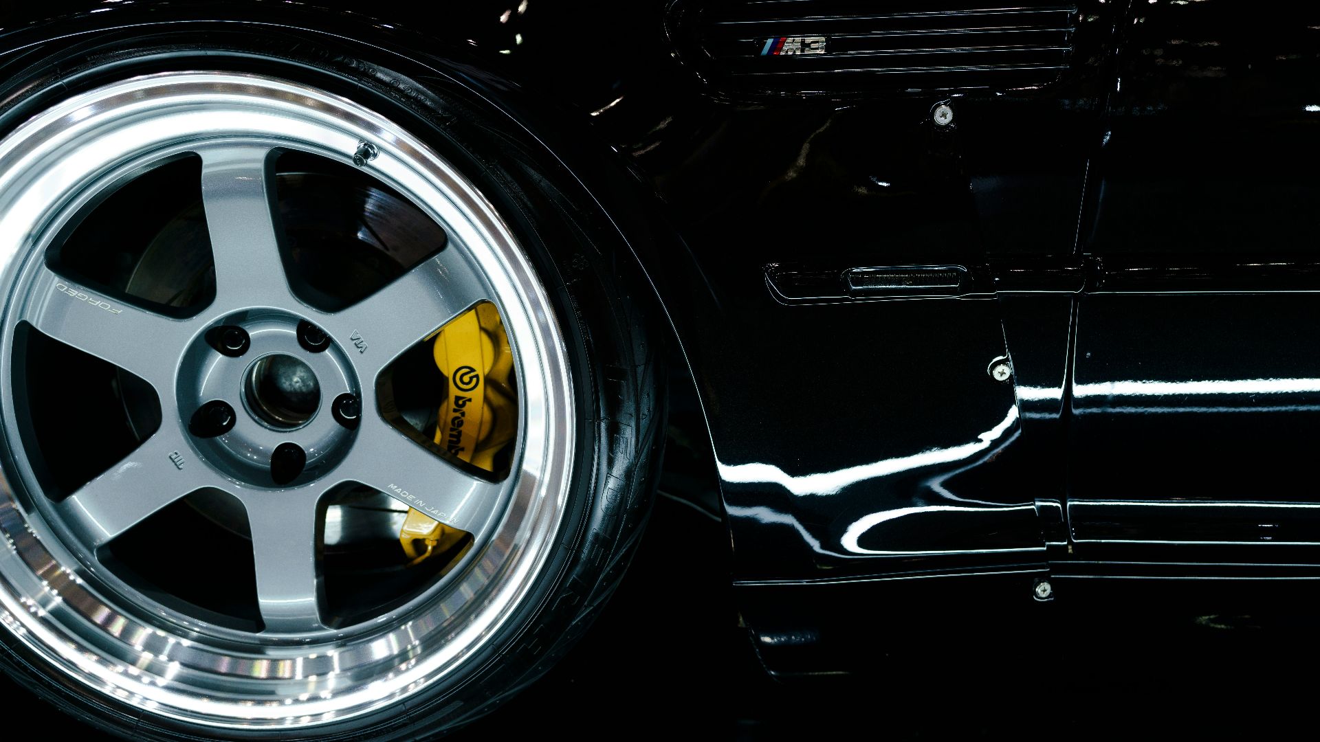 A close up of a car's wheels and tires