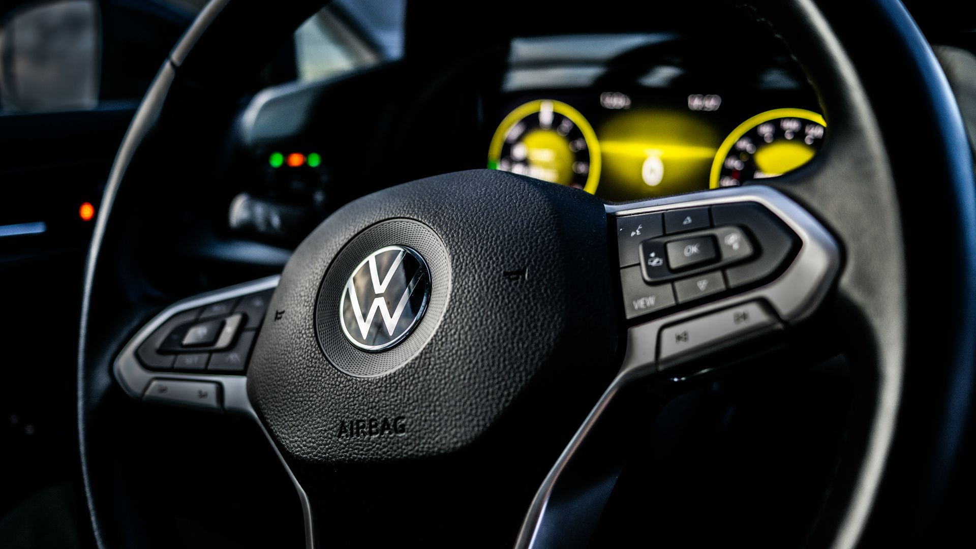 a steering wheel and dashboard of a car