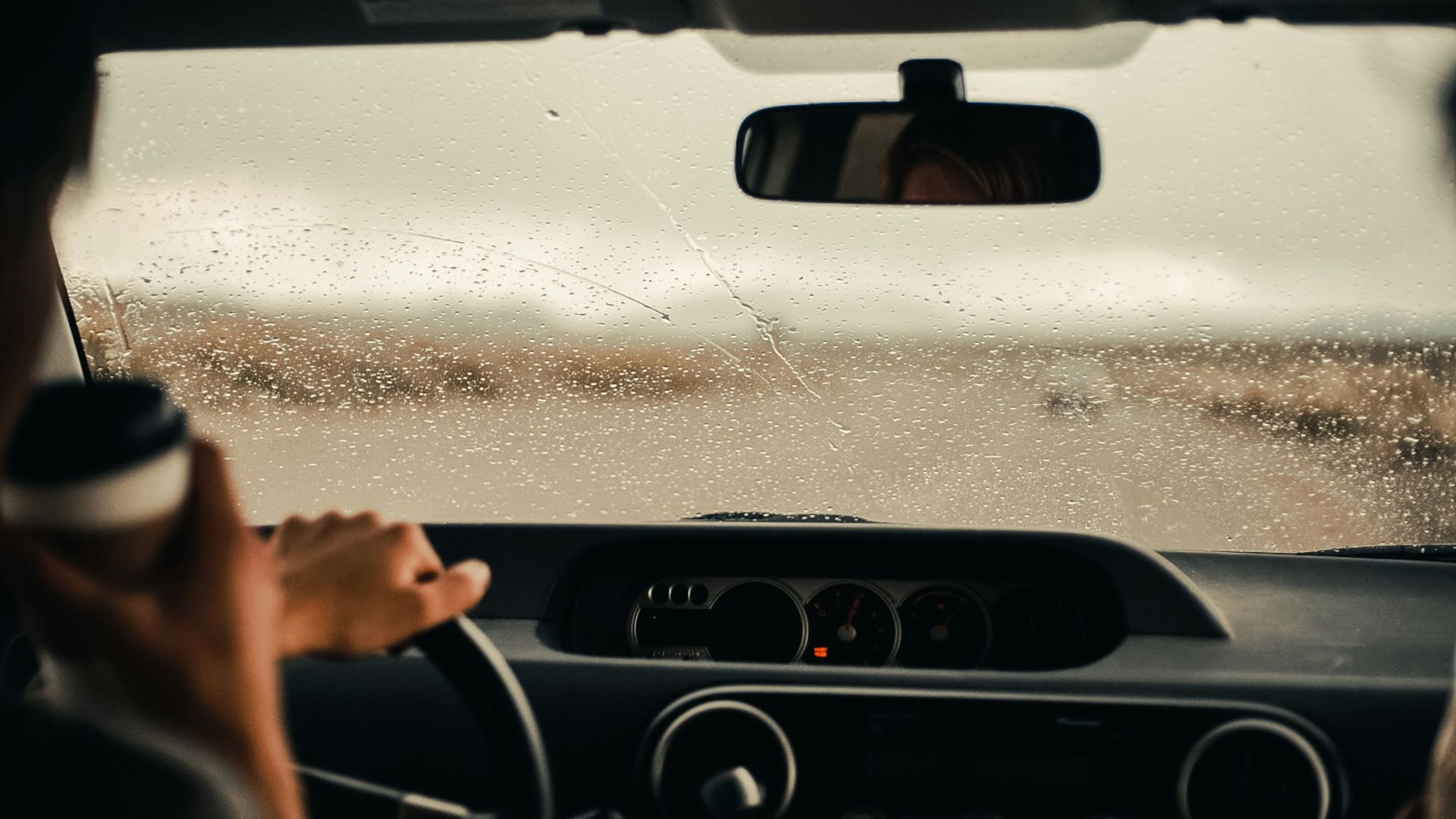 person driving car during daytime
