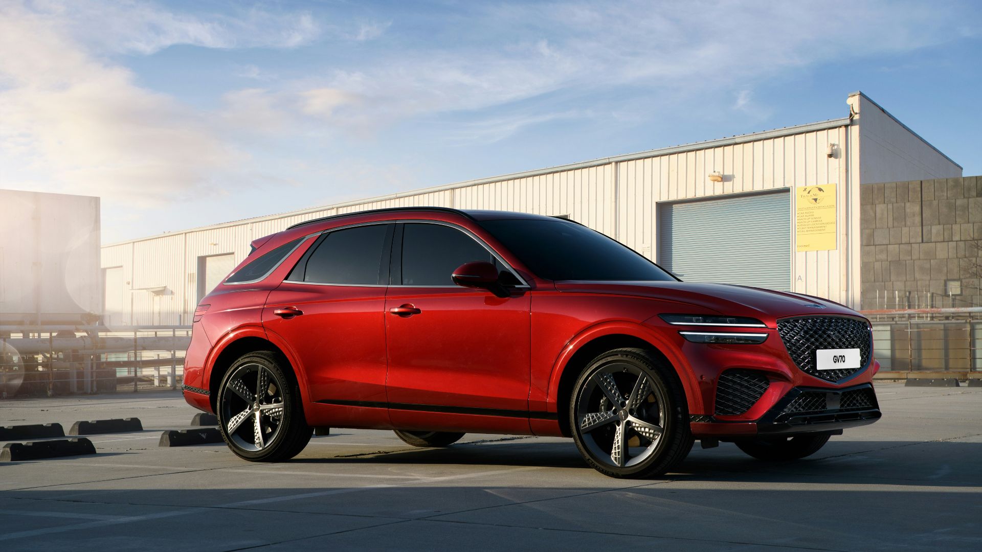 a red car parked in front of a building