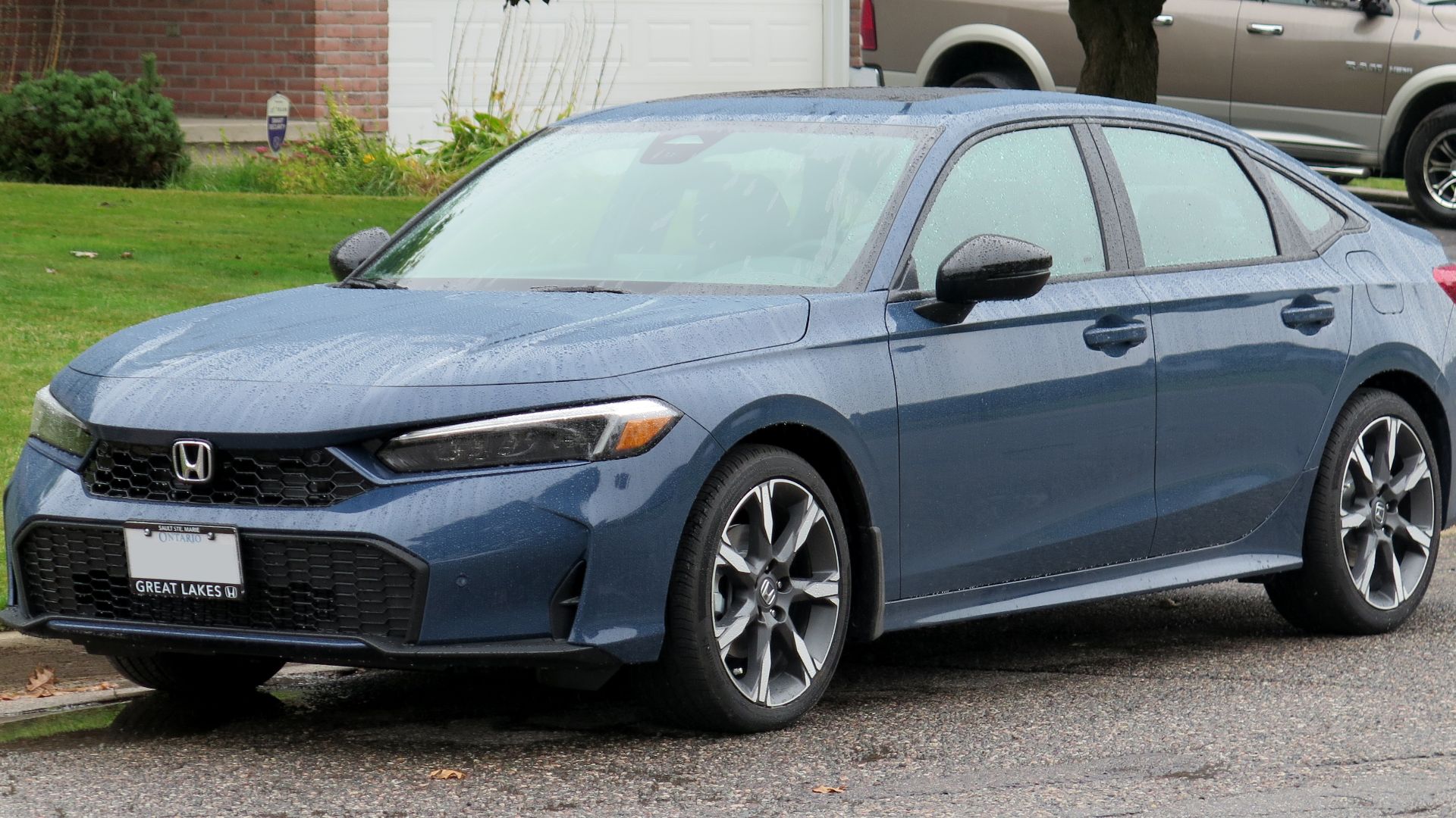 File:2025 Honda Civic Sport Touring Hybrid in Blue Lagoon, front left, 2024-09-24.jpg