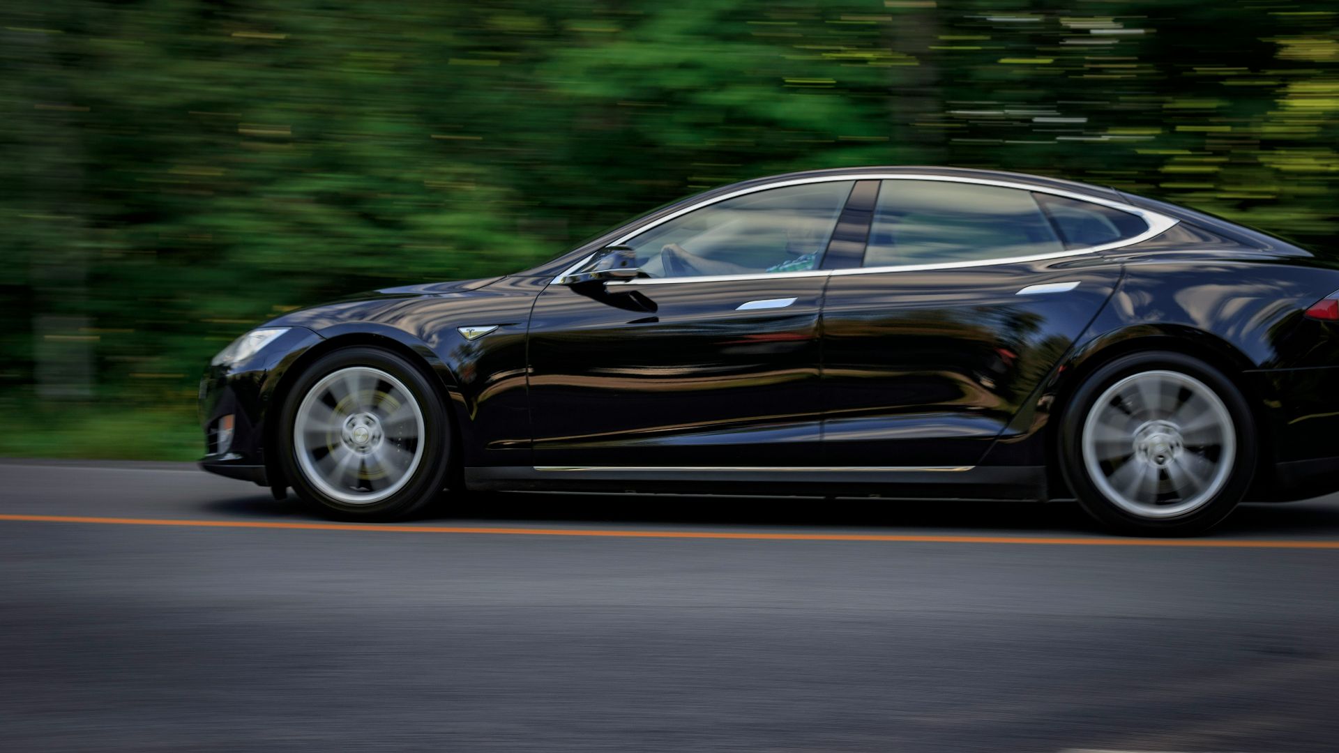 black sedan on gray concrete road
