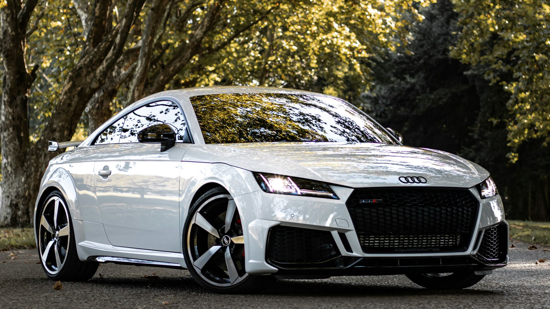 white bmw m 3 coupe parked on gray concrete road during daytime