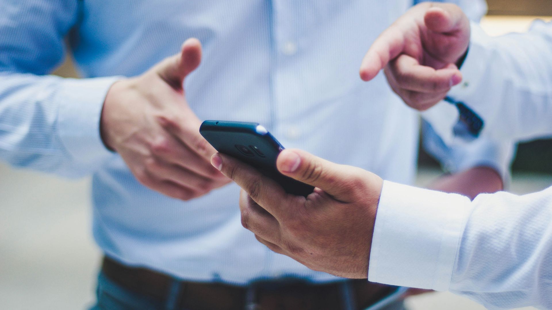 person holding black smartphone