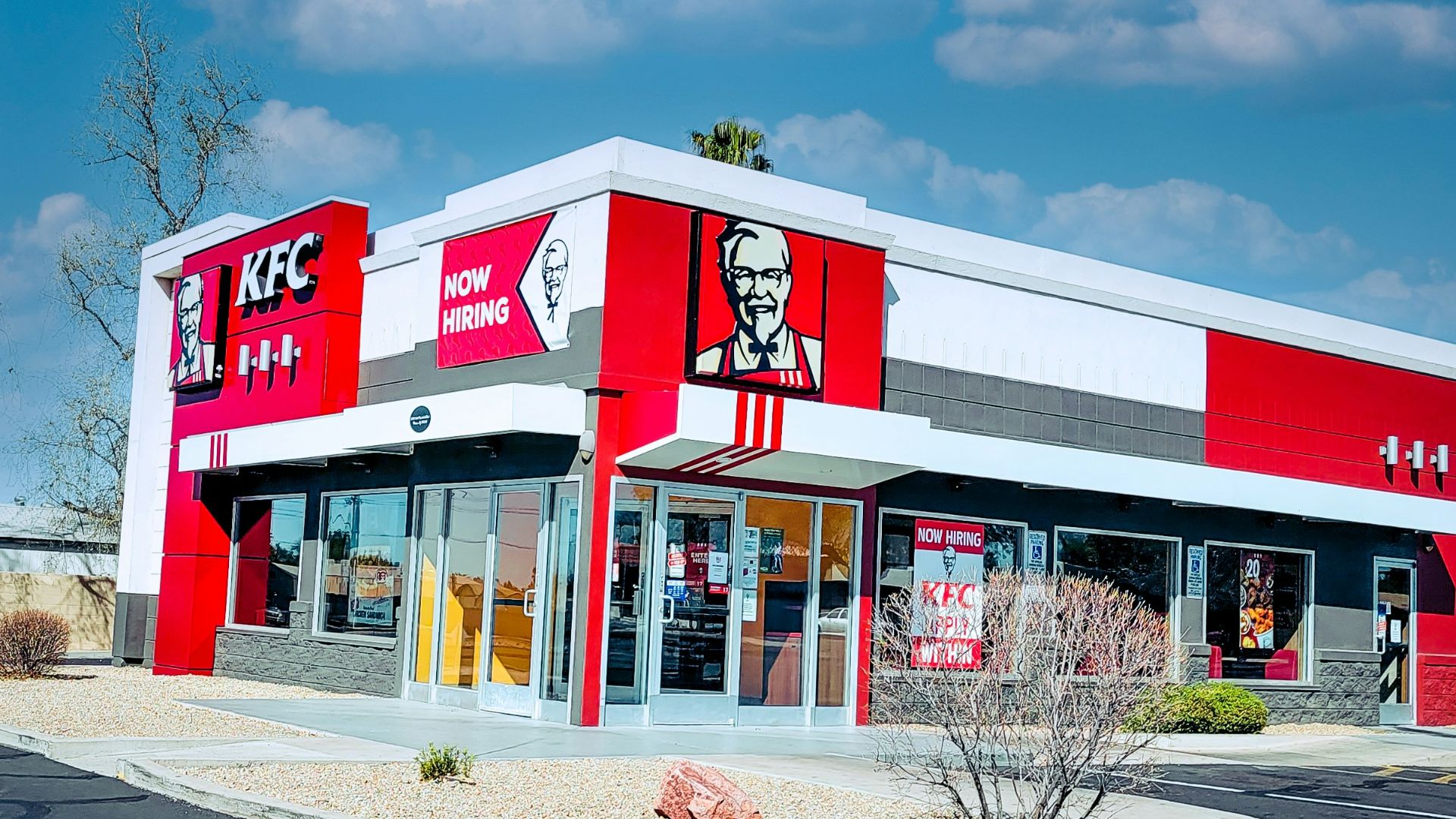 red and white concrete building under blue sky during daytime