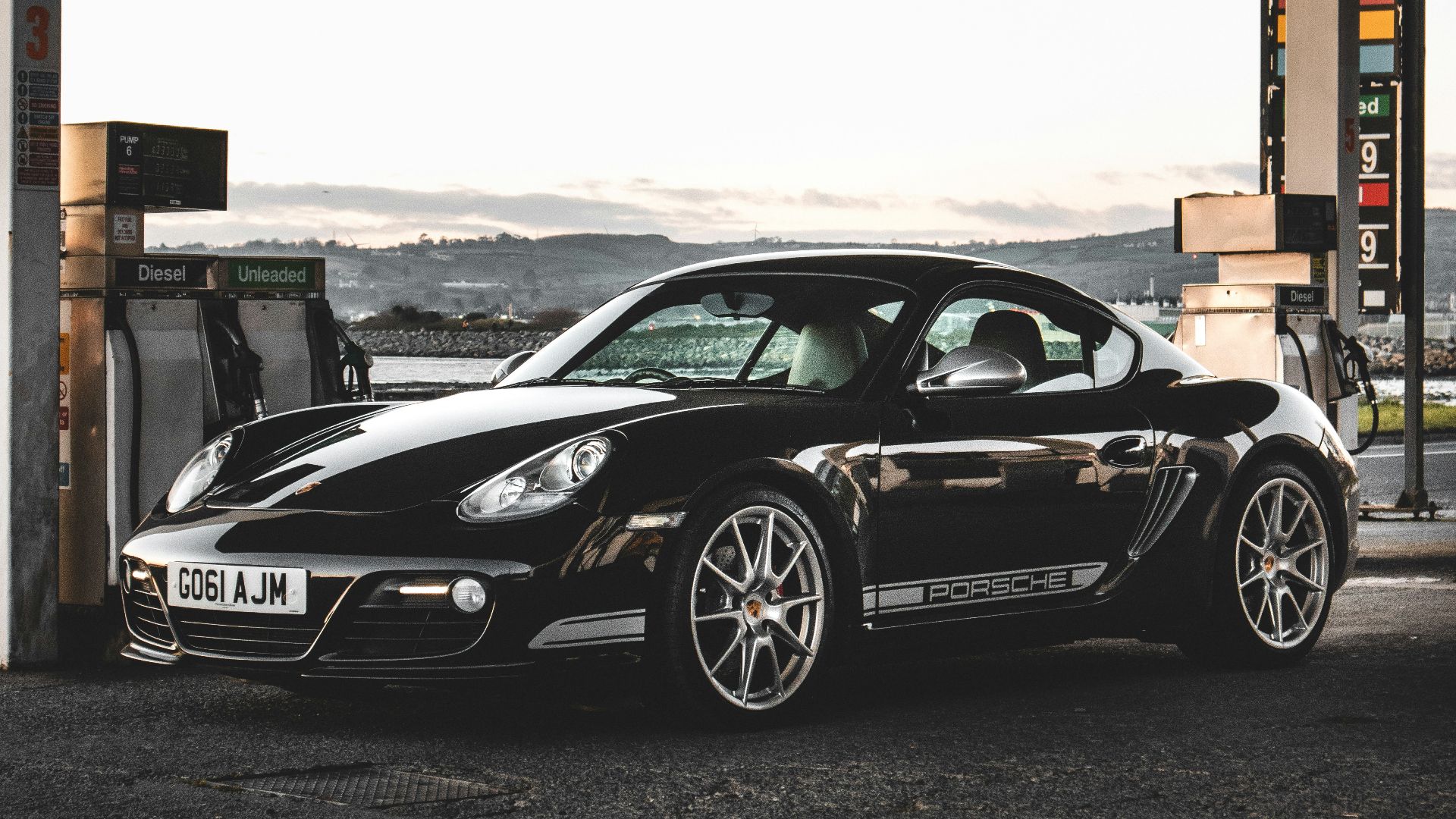 black porsche 911 parked on parking lot during daytime