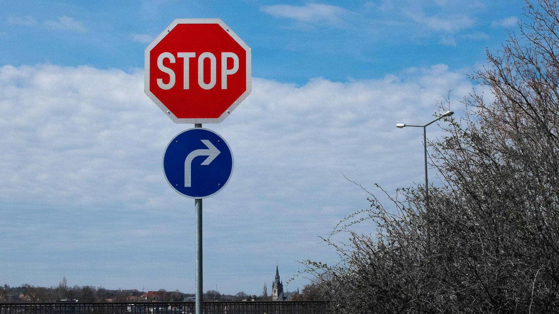 stop sign on road during daytime